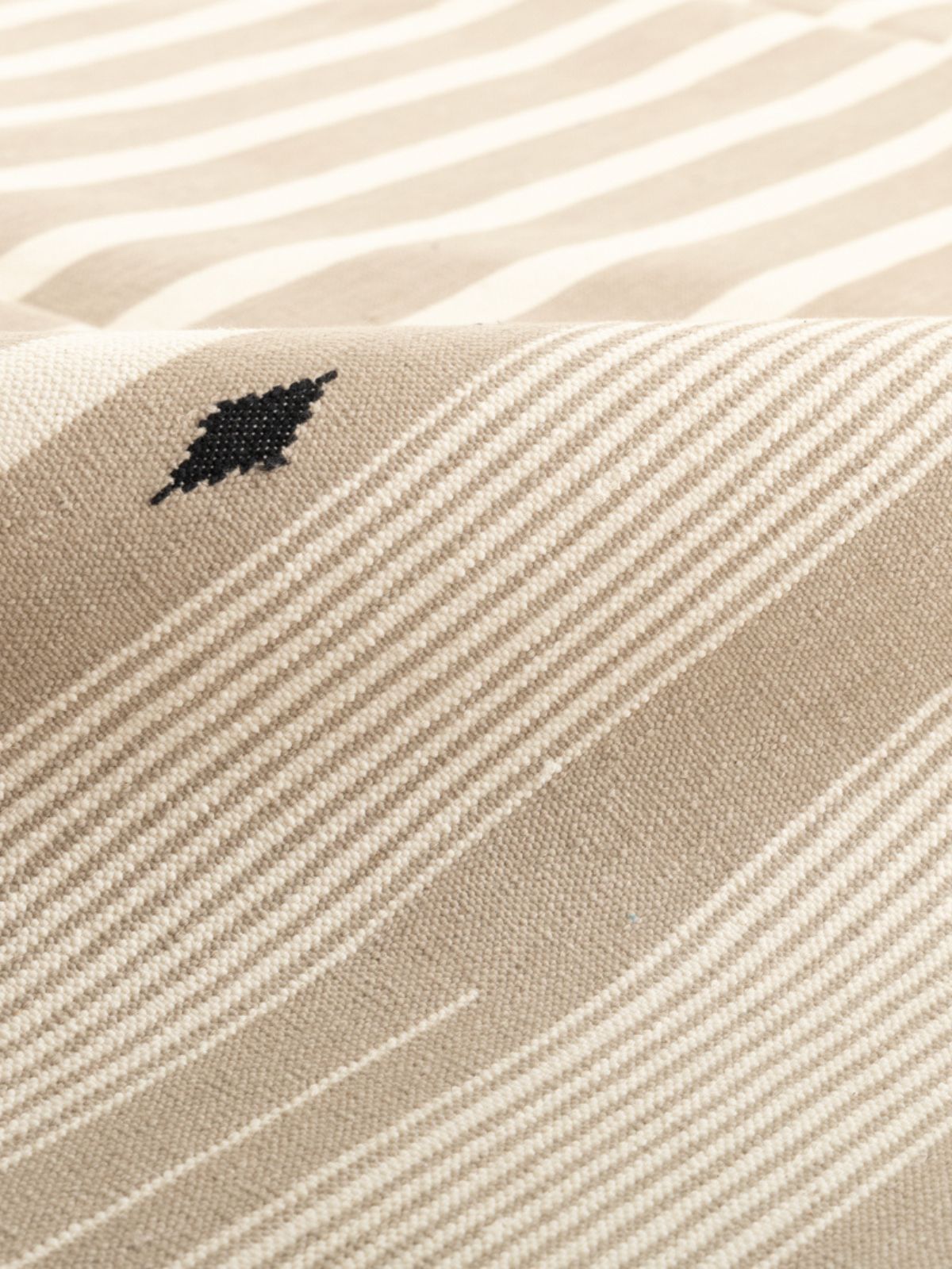 Serenity Stripes Flatweave Rug-Beige detail of the striped cotton surface and edge finishing
