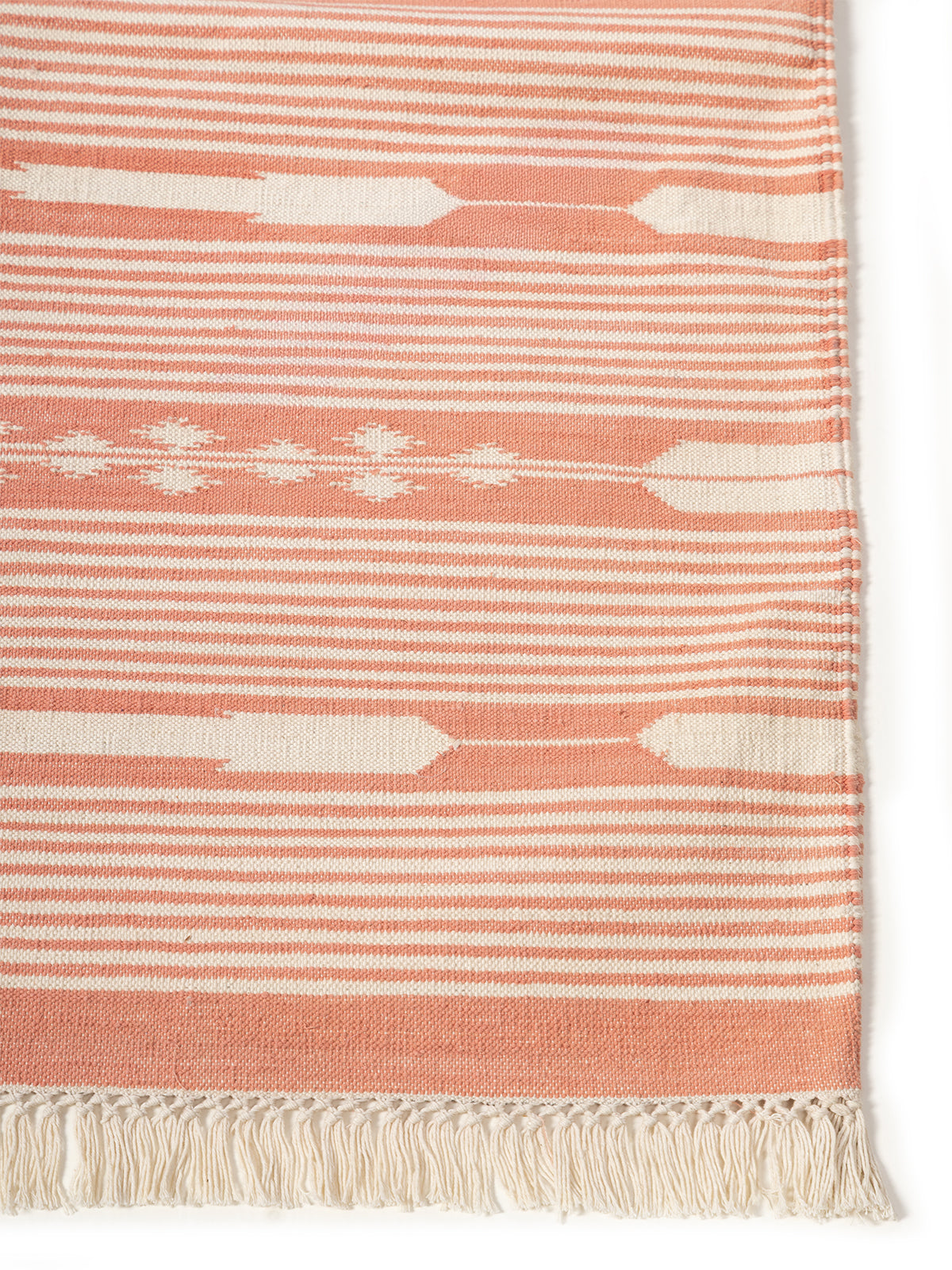 Serenity Stripes Flatweave Rug-Peach cotton rug styled in a living room interior