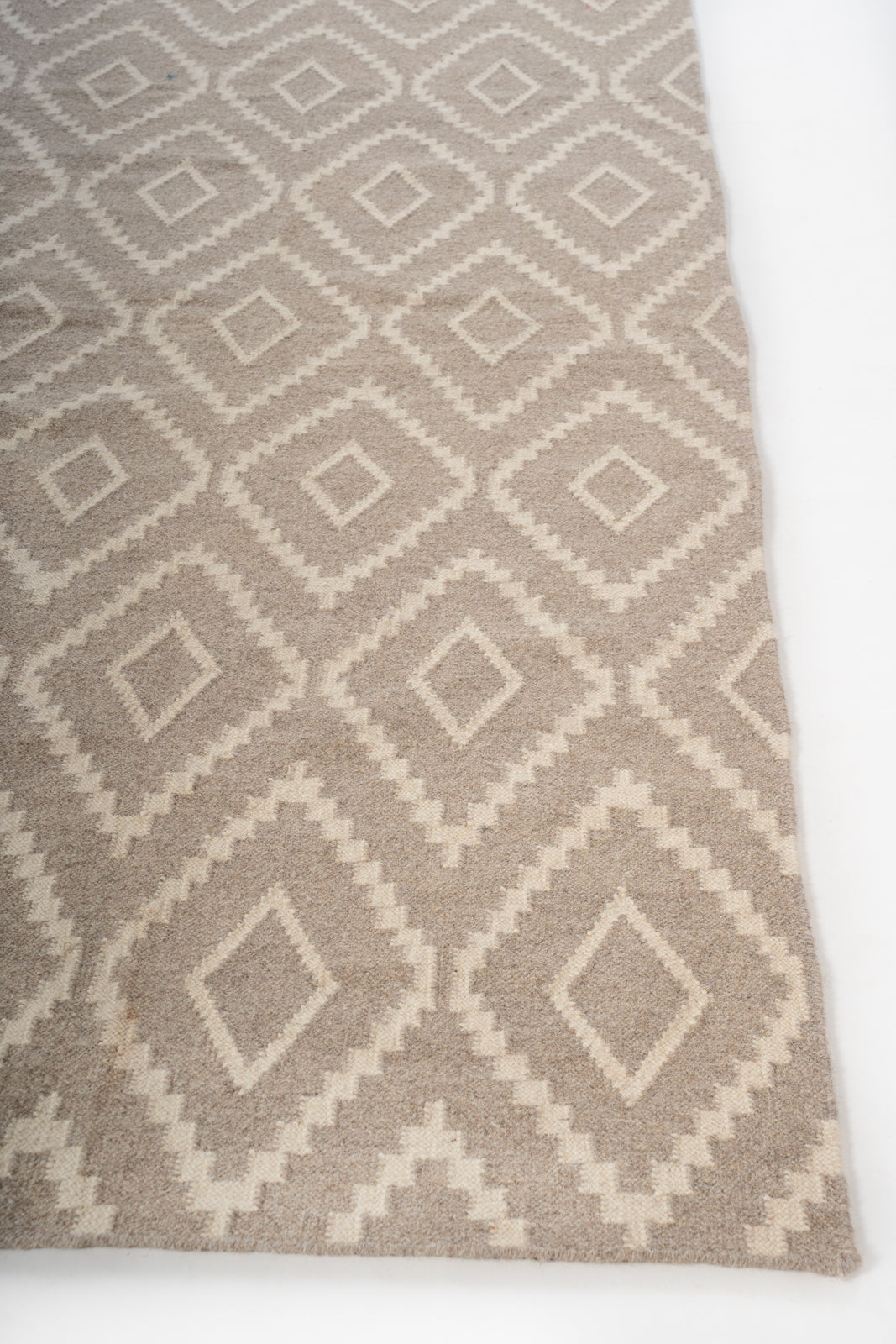 Sirohi Diamond Weave Rug wool rug styled in a living room interior