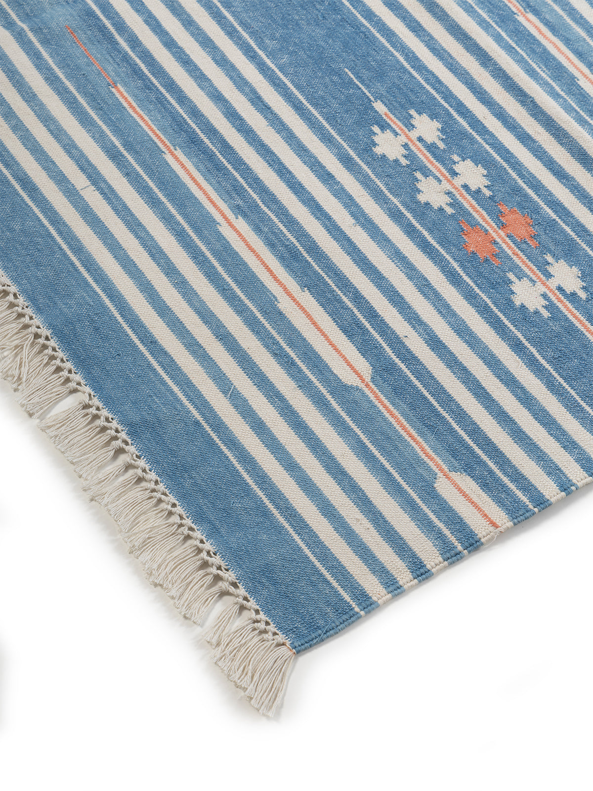 Sky Drift Rug-Light blue close-up showing the cotton weave and striped pattern