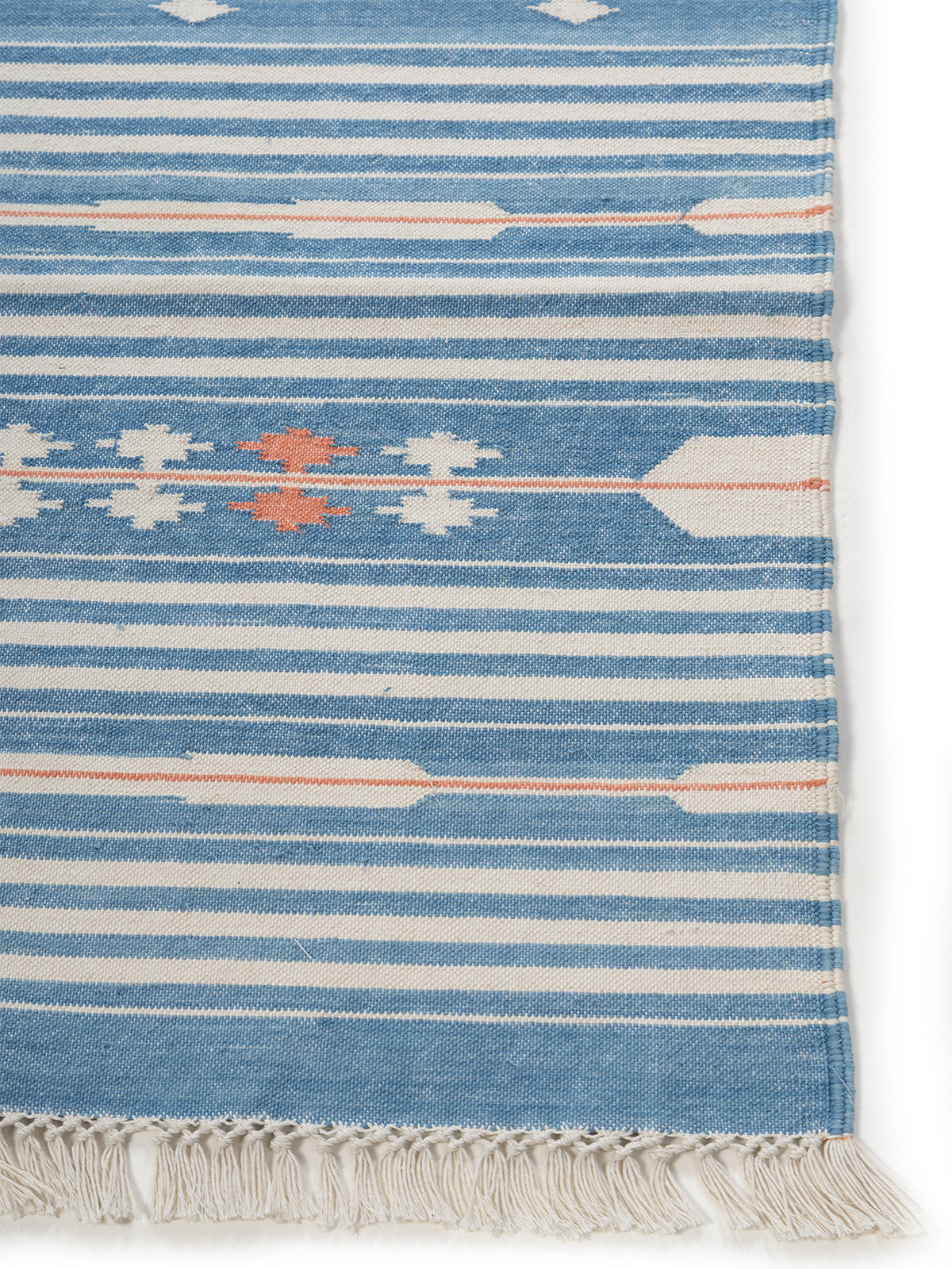 Sky Drift Rug-Light blue cotton rug styled in a living room interior