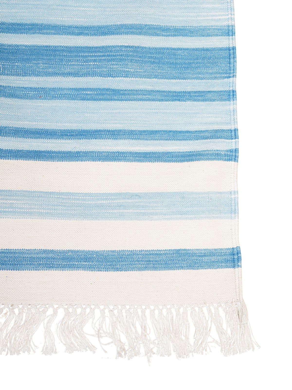 Skyline Hue Striped Rug cotton rug styled in a living room interior