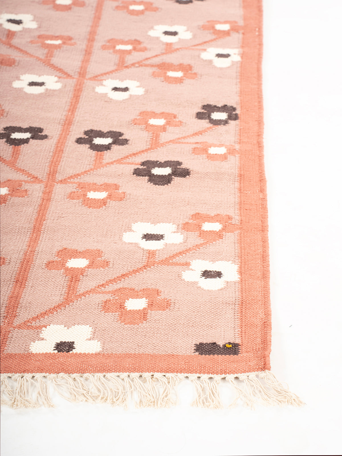 Spring Petals Handwoven Wool Rug wool rug styled in a living room interior
