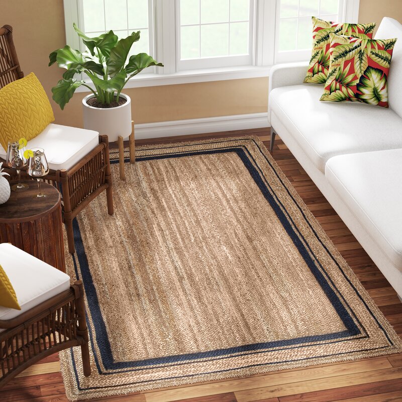 Suez bordered jute braided area rug-Navy detail of the striped jute surface and edge finishing