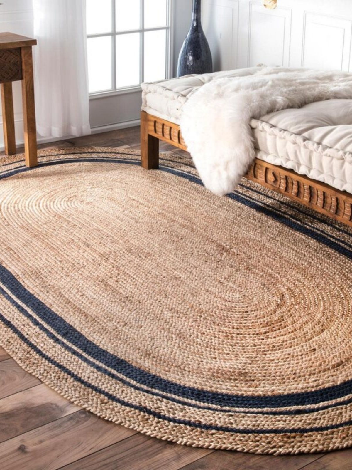 Suez bordered jute braided oval rug jute rug styled in a designed interior