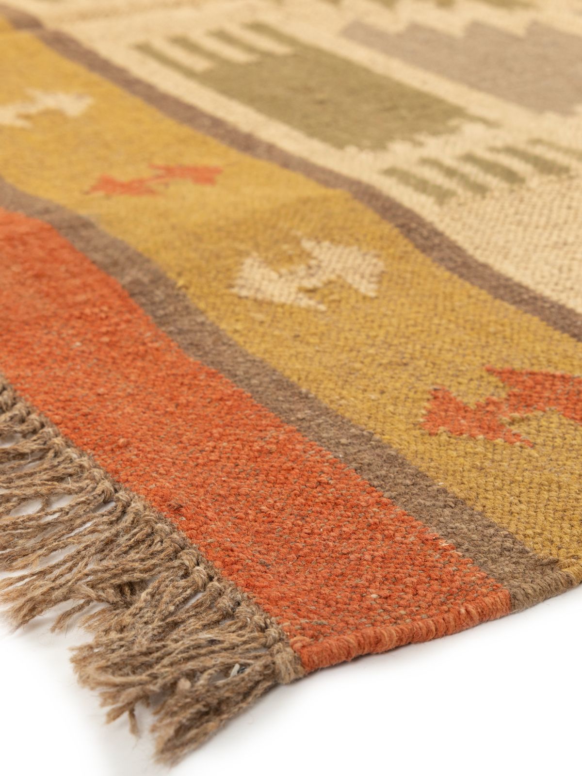 Sunbaked terracotta Kilim Rug close-up showing the cotton weave and traditional motif