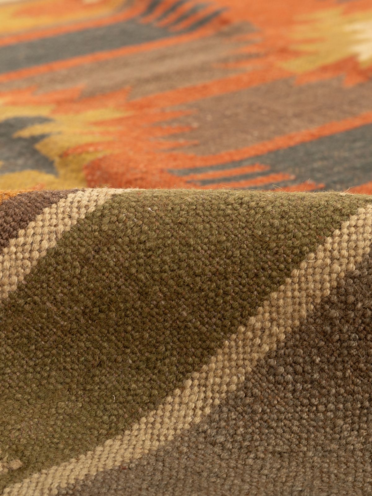 Sunbaked terracotta Kilim Rug detail of the traditional motif in cotton