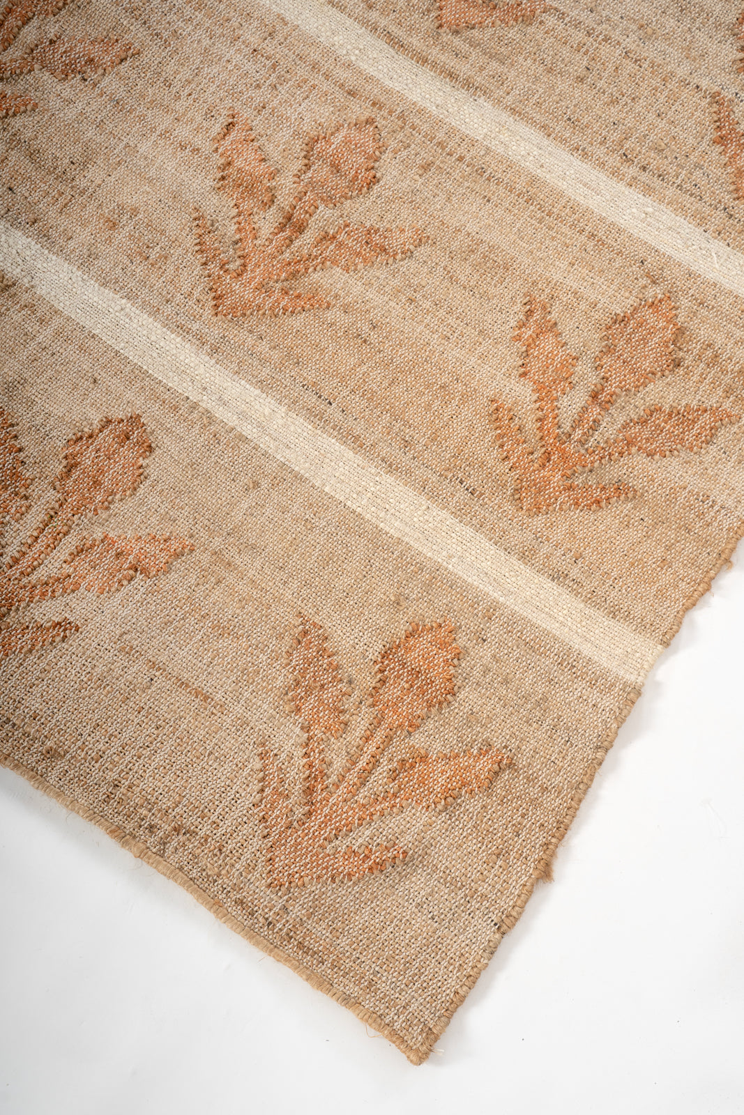 Sunset Grove Handwoven Jute Rug close-up showing the jute weave and striped pattern