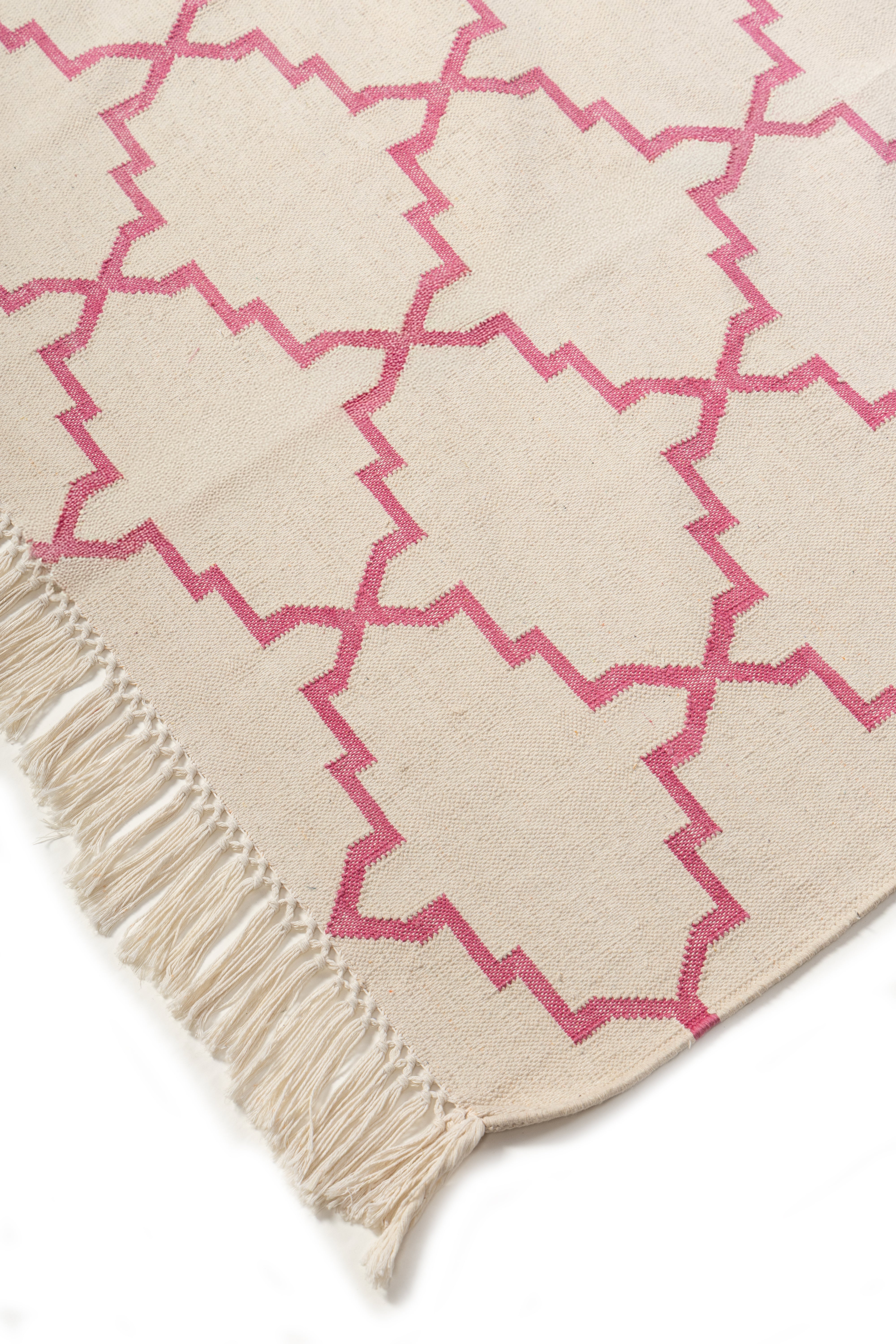 Symmetry Flatweave Rug-Pink close-up showing the cotton weave and geometric motif