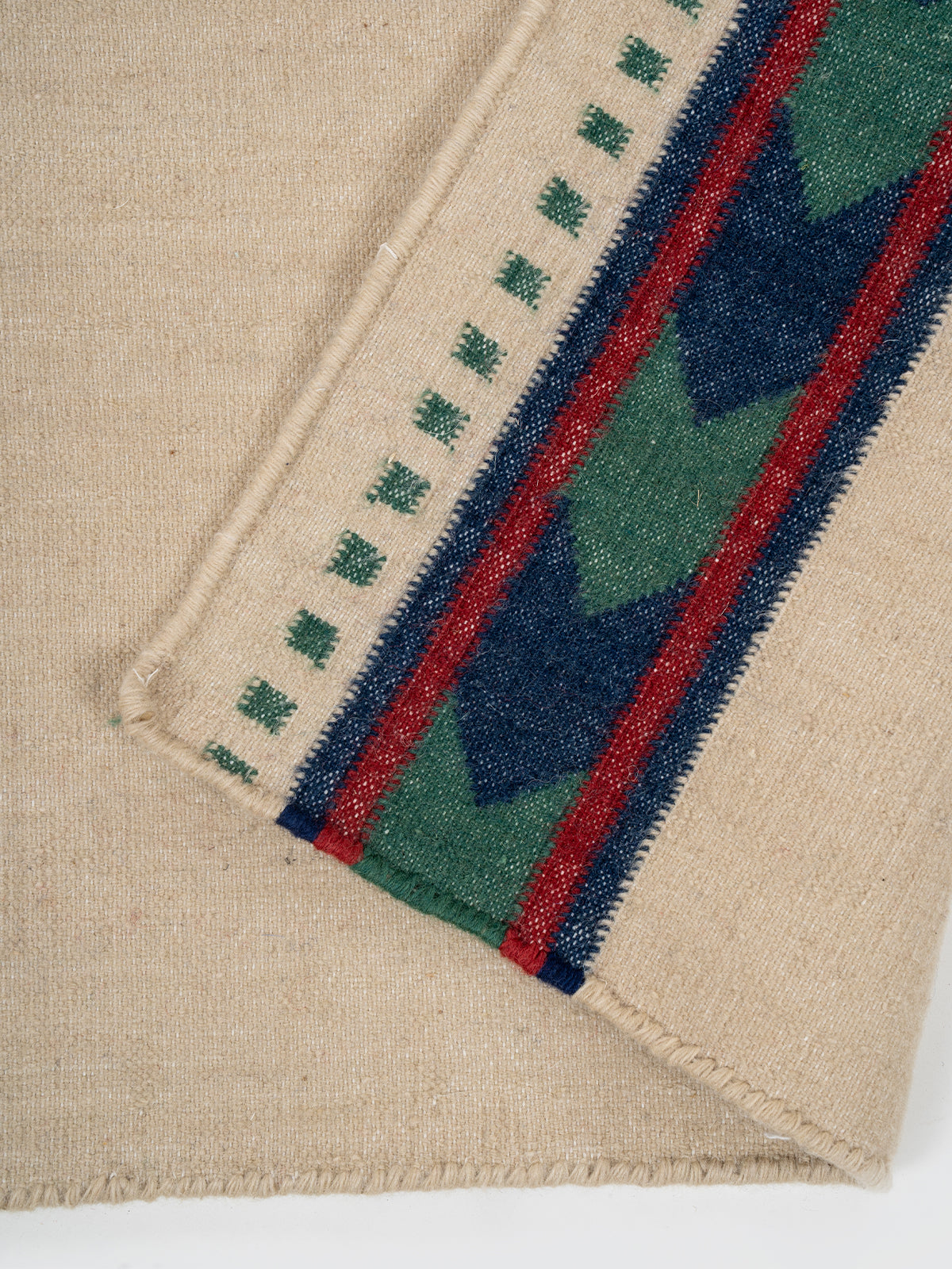 Tan Moor Runner detail showing edge binding and cotton finishing of the runner