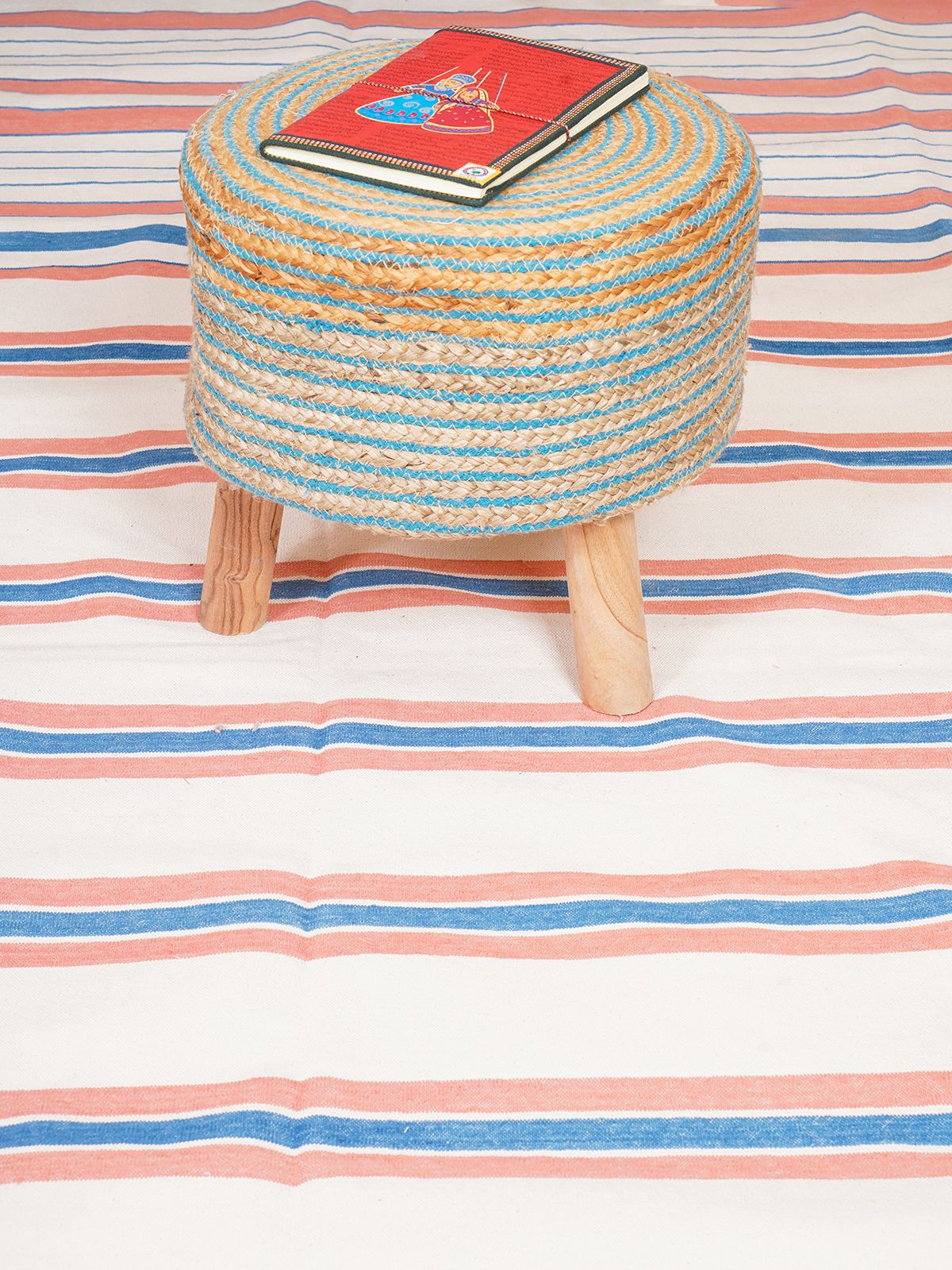Temple Stripe Flatweave rug-Peach cotton rug styled in a living room interior