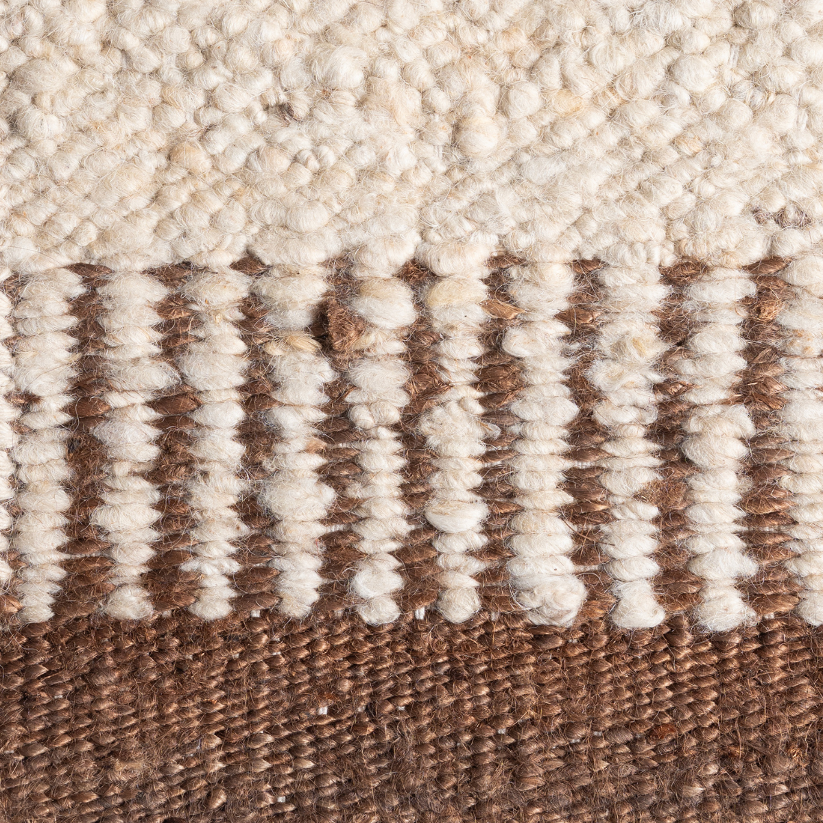 Terra Border : Umber Anchor close-up showing the wool-jute weave and surface texture
