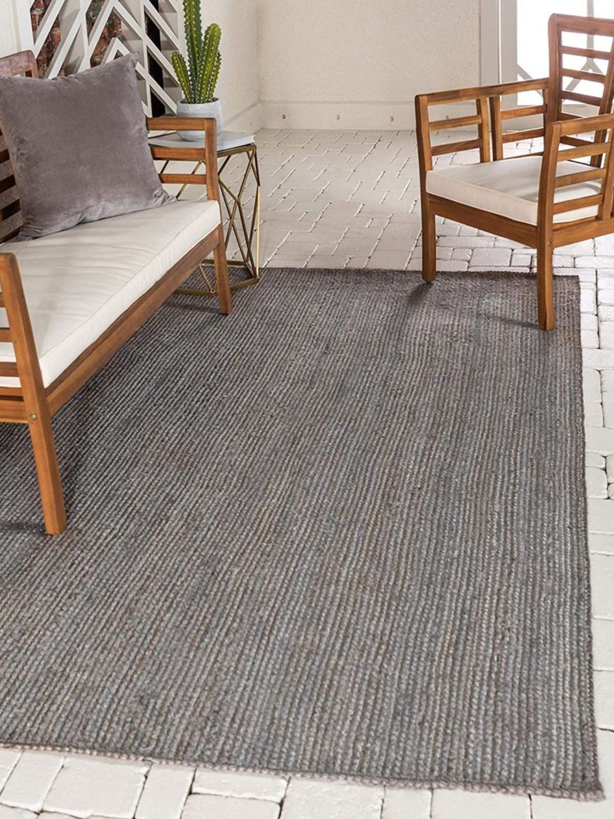 Thaba braided area rug-Grey jute rug styled in a living room interior