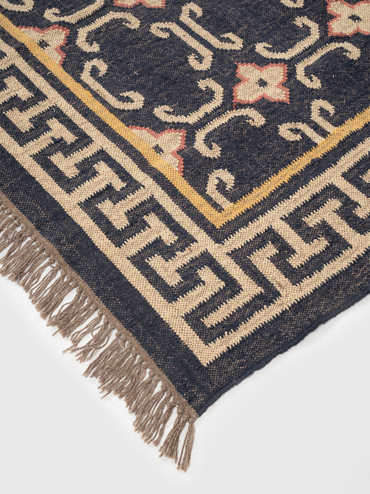 The Aegean Key Rug close-up showing the wool weave and traditional motif