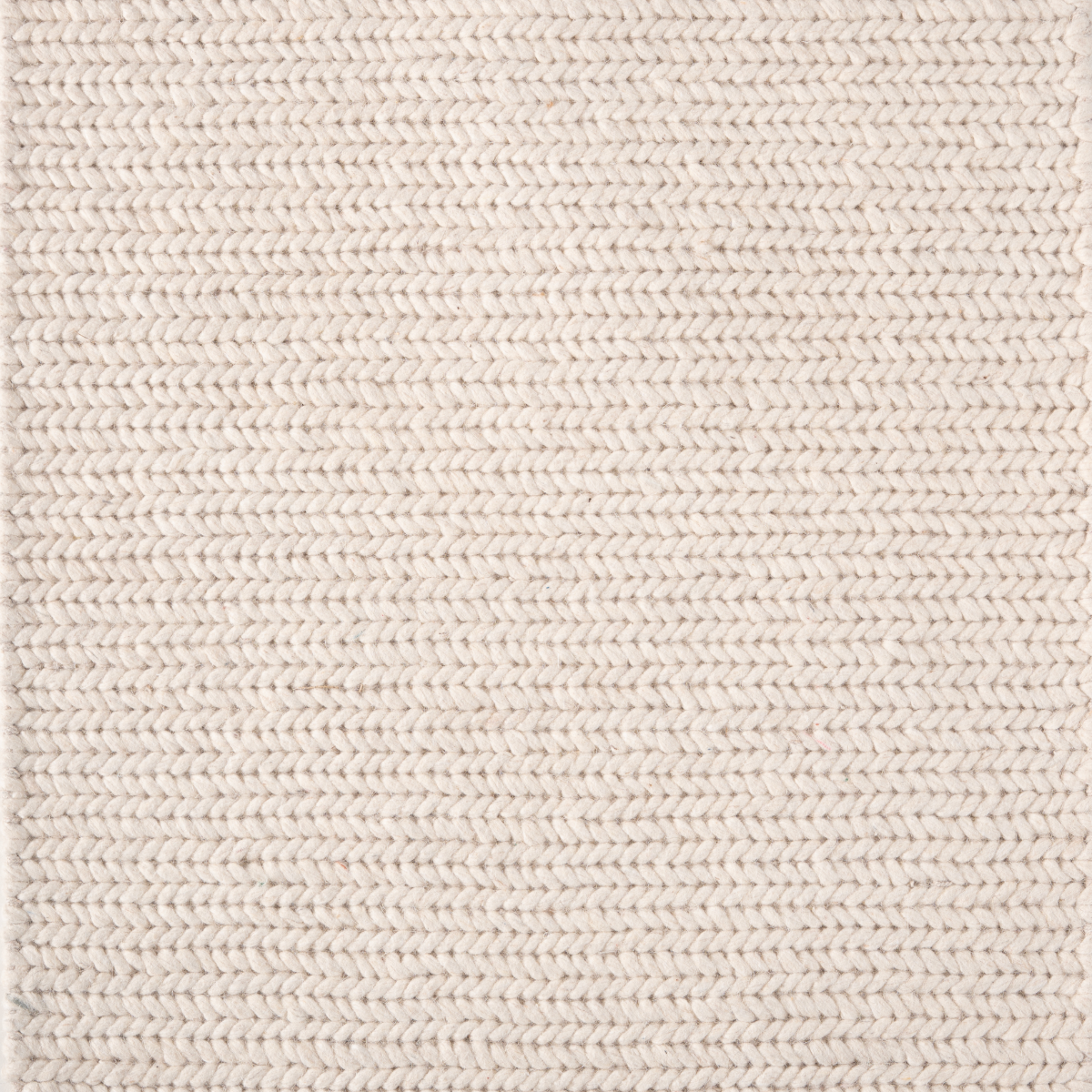 The Alpine Braid wool rug product view in neutral tones