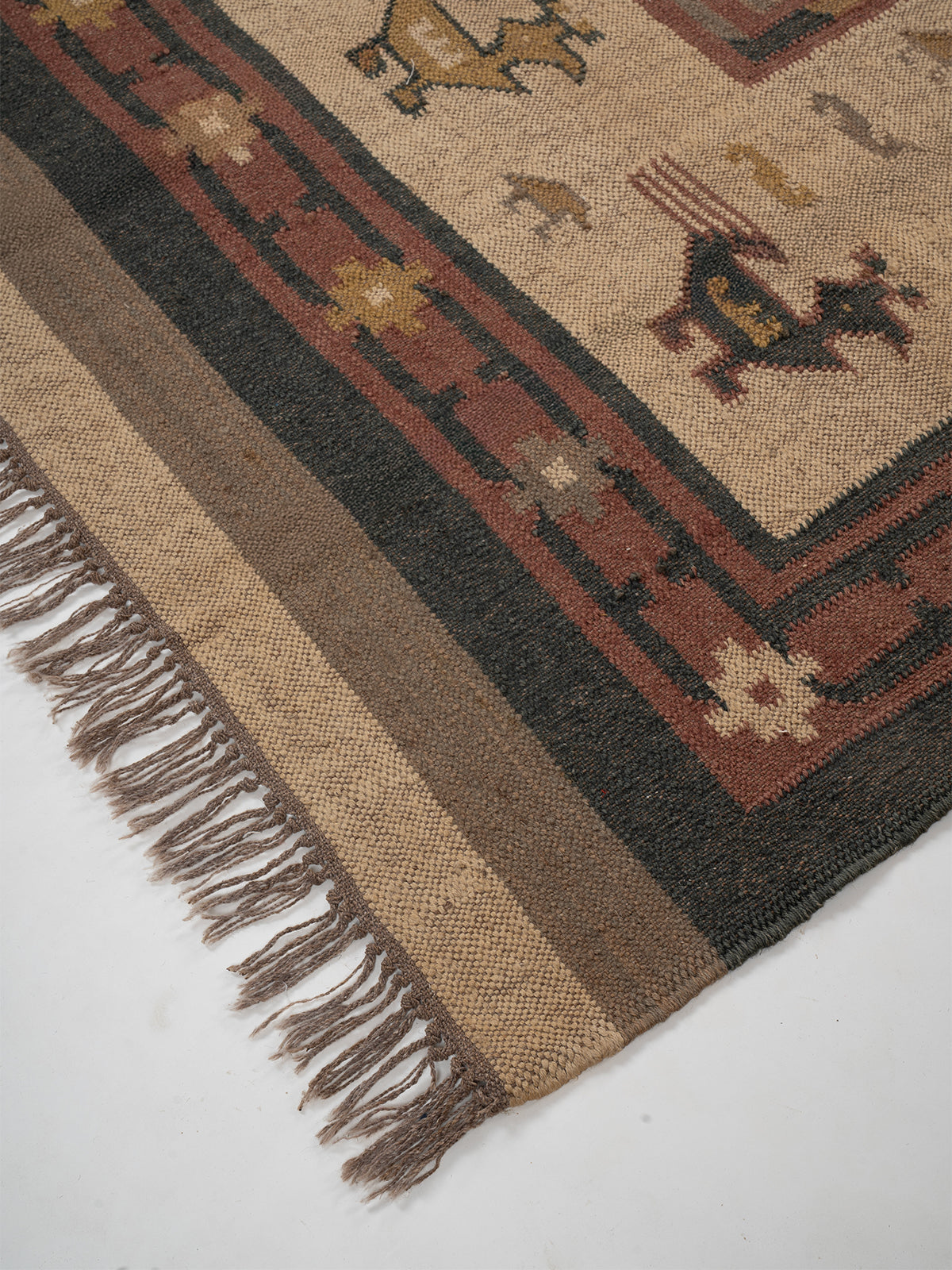 The Bestiary Weave Kilim-Beige close-up showing the wool weave and traditional motif