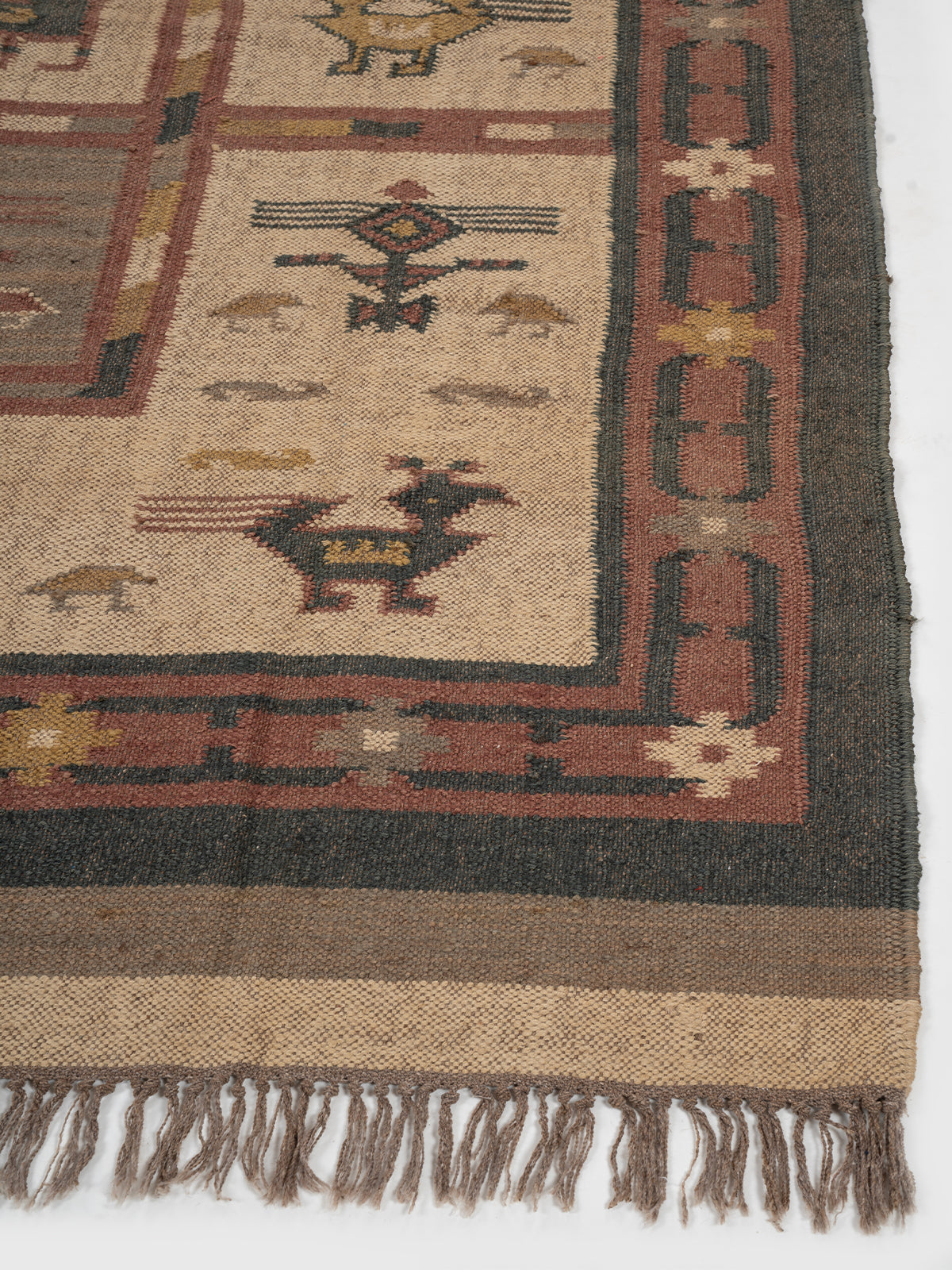 The Bestiary Weave Kilim-Beige wool rug styled in a living room interior