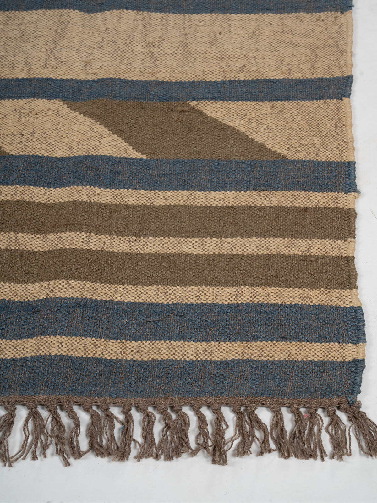 The Canyon Blocks Kilim wool rug styled in a living room interior