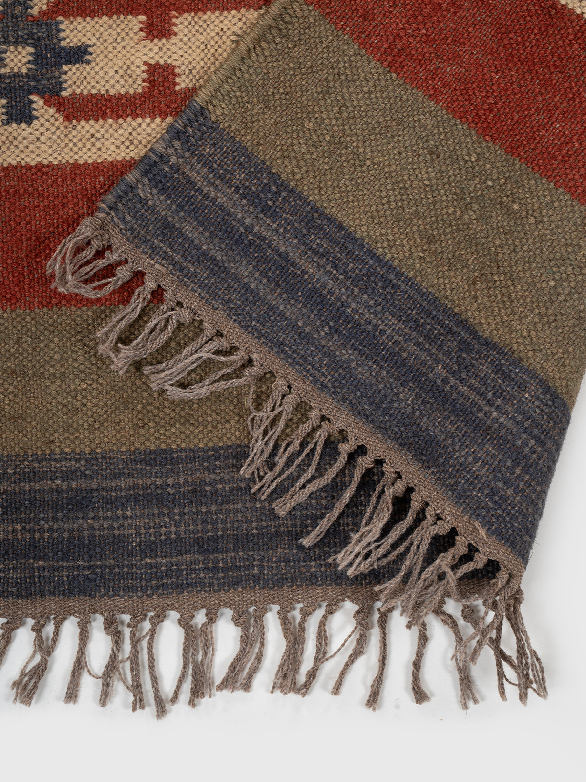 The Canyon Story Runner detail showing edge binding and wool finishing of the runner
