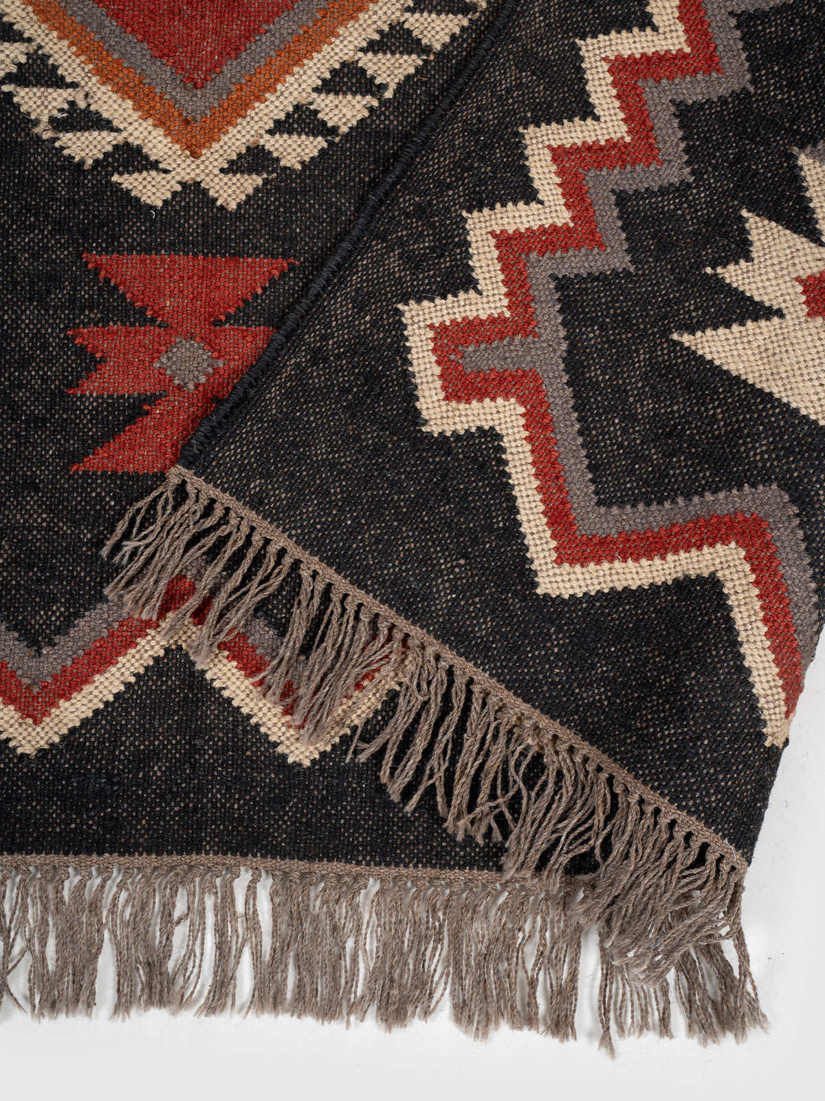 The Charcoal Peak Rug detail of the geometric pattern in wool