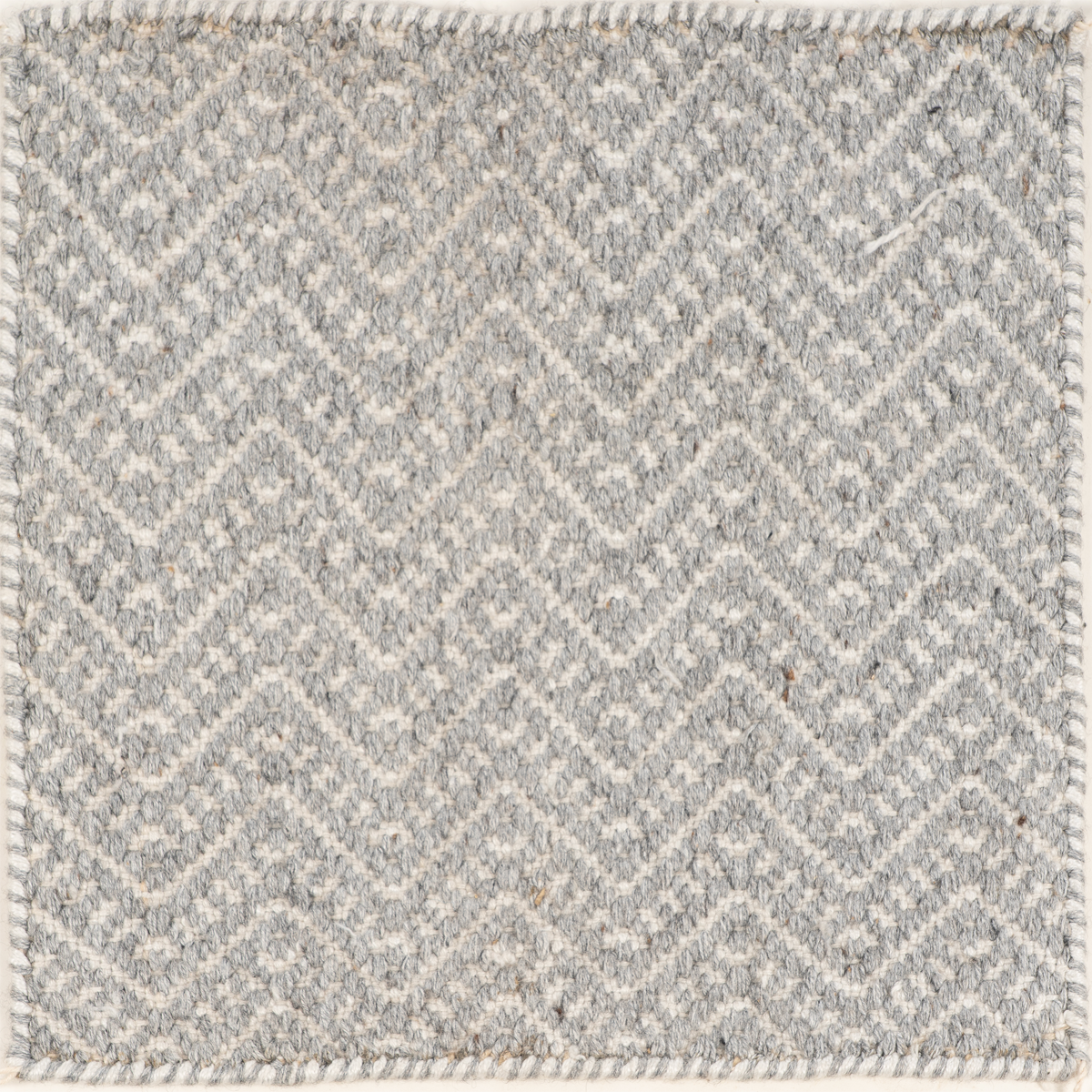 The Chevron Eco-Knit recycled pet rug in neutral tones
