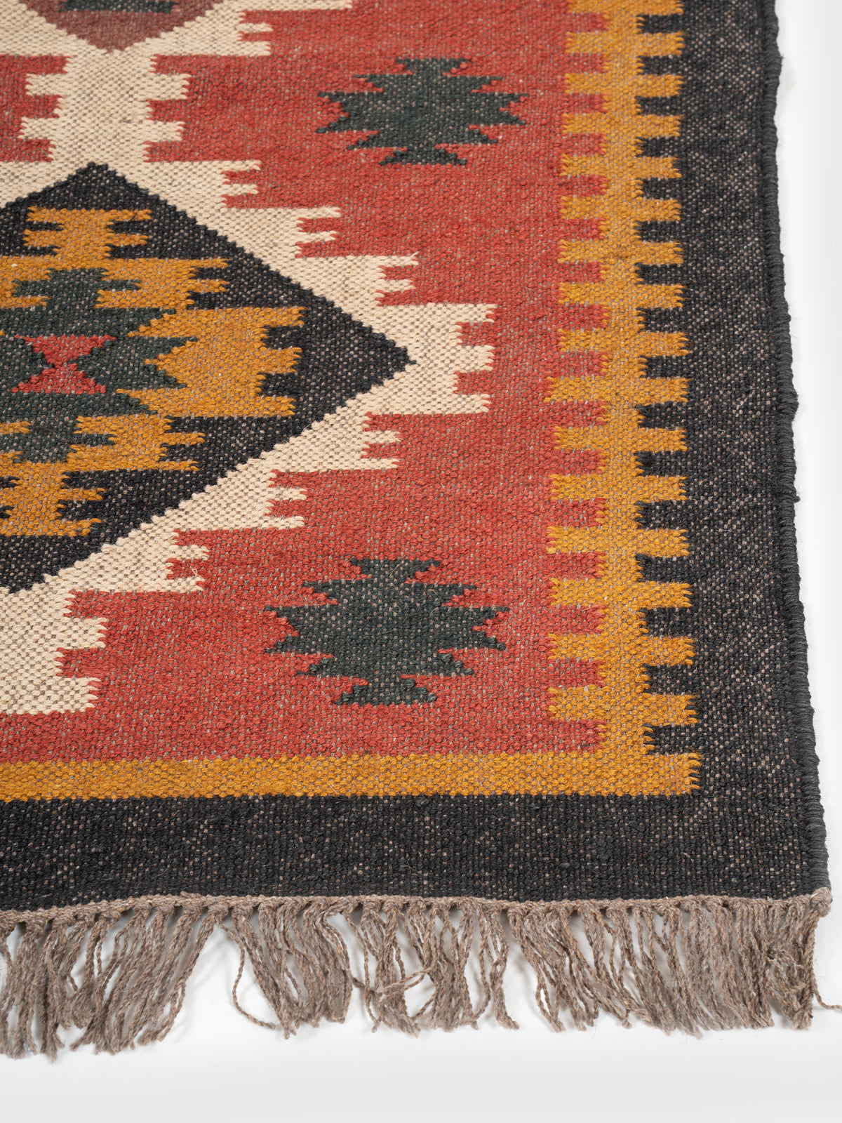 The Crimson Dash Runner wool stair runner styled on a staircase in a designed interior