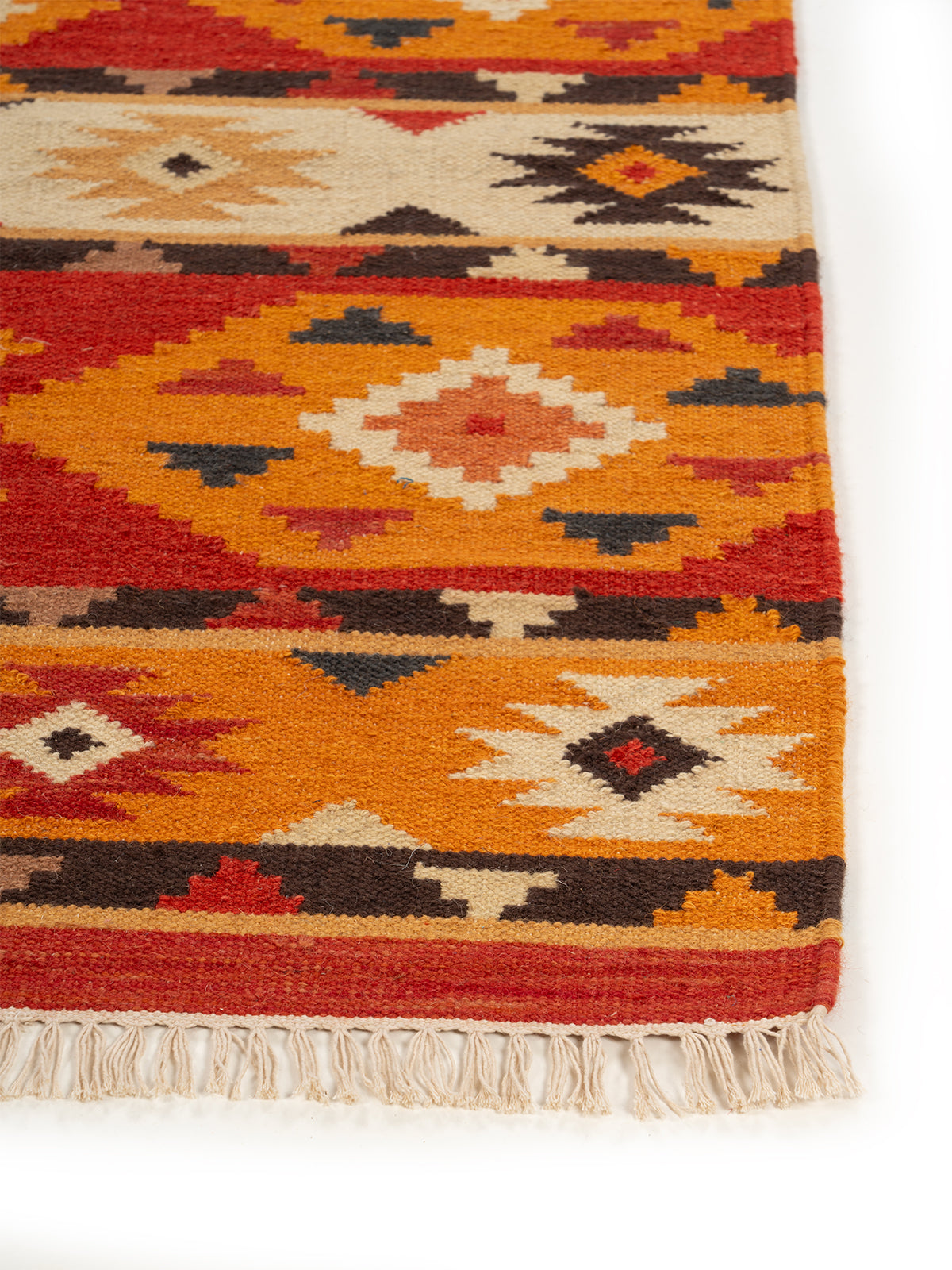 The Desert Sun Rug wool rug styled in a living room interior