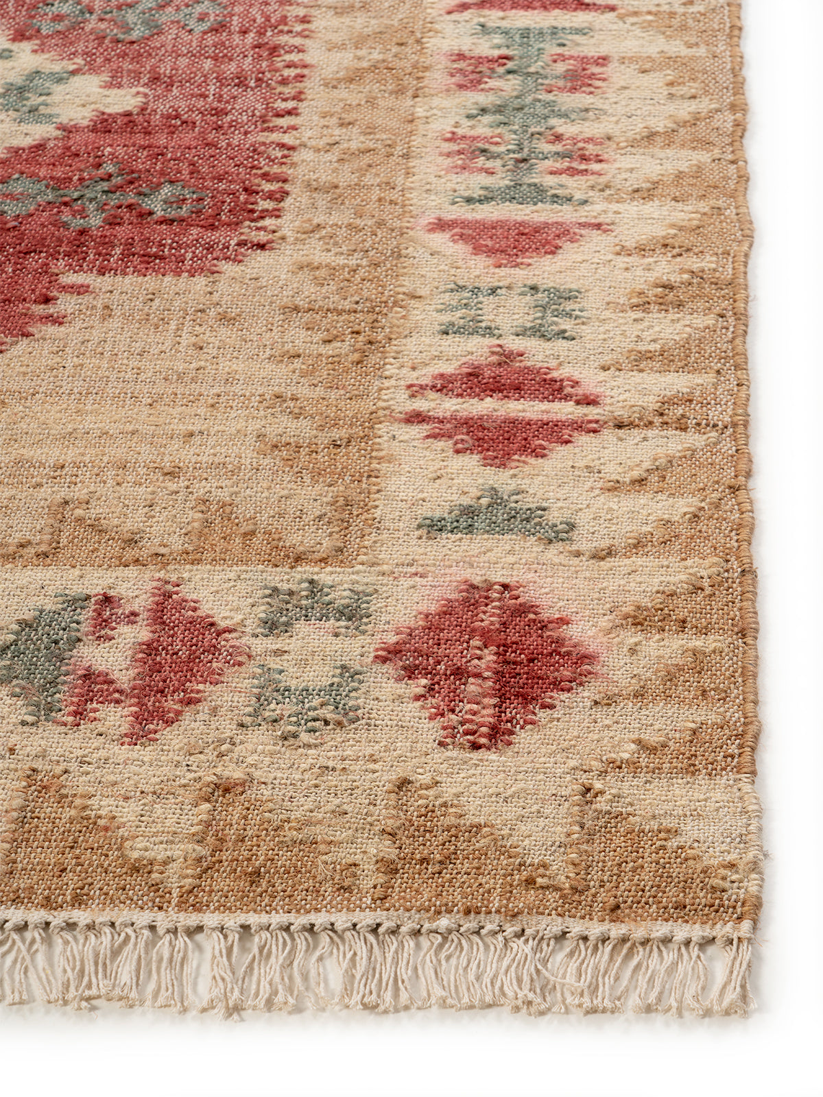 The Earth Medallion Rug jute rug styled in a living room interior