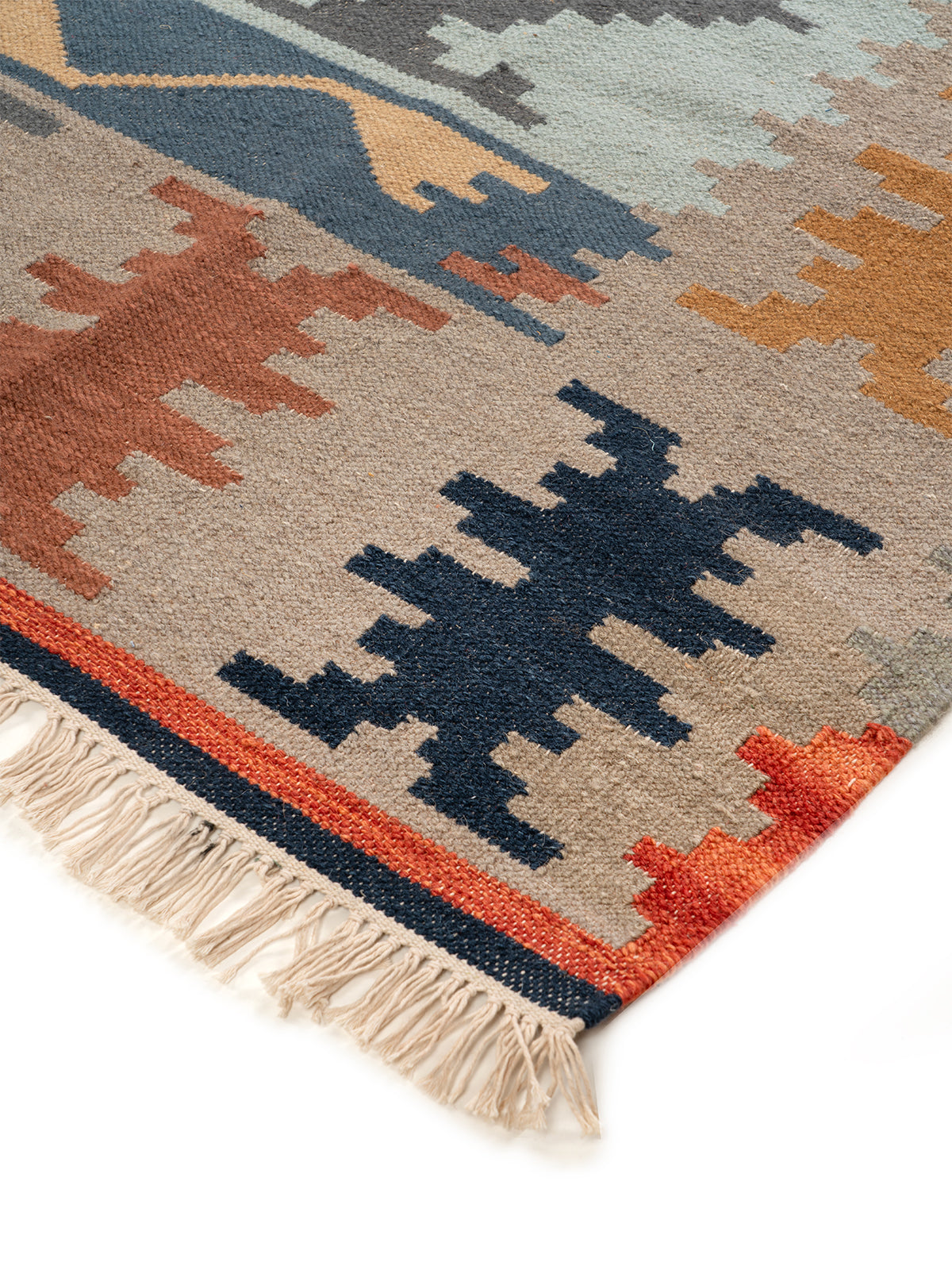 The Earth & Sea Rug close-up showing the wool weave and geometric motif