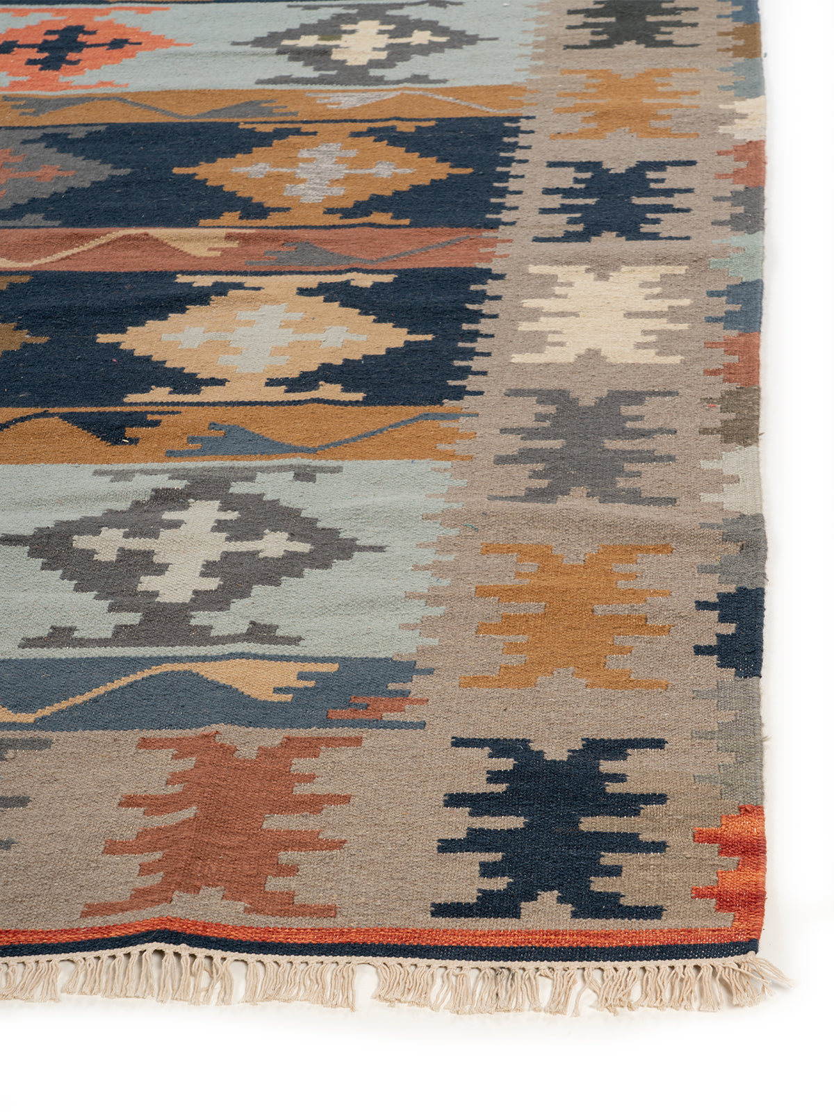 The Earth & Sea Rug wool rug styled in a living room interior