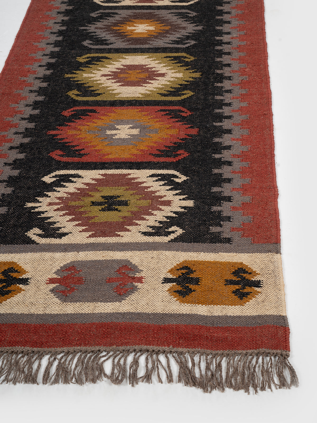 The Ember Diamond Runner wool stair runner styled on a staircase in a designed interior