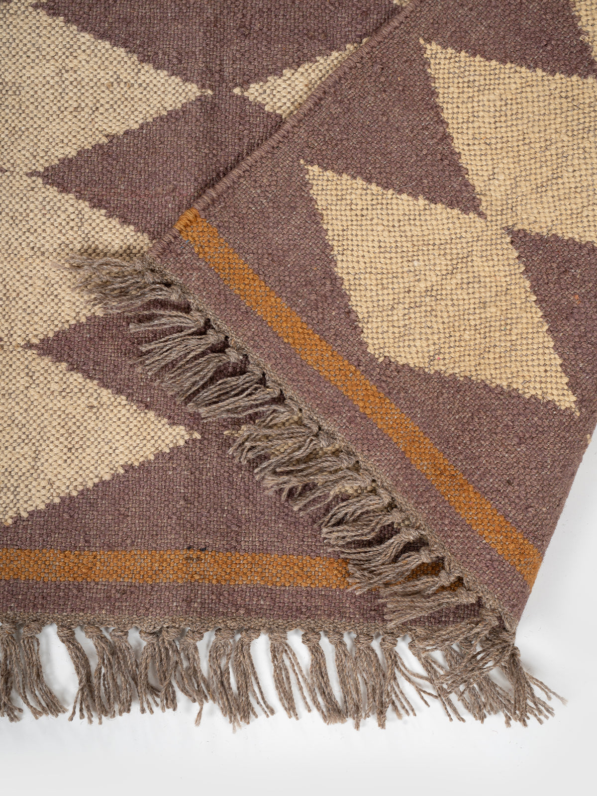 The Ember Star Rug detail of the geometric pattern in wool