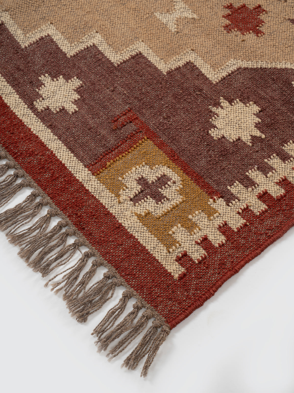 The Fortress Shield Kilim close-up showing the wool weave and geometric motif