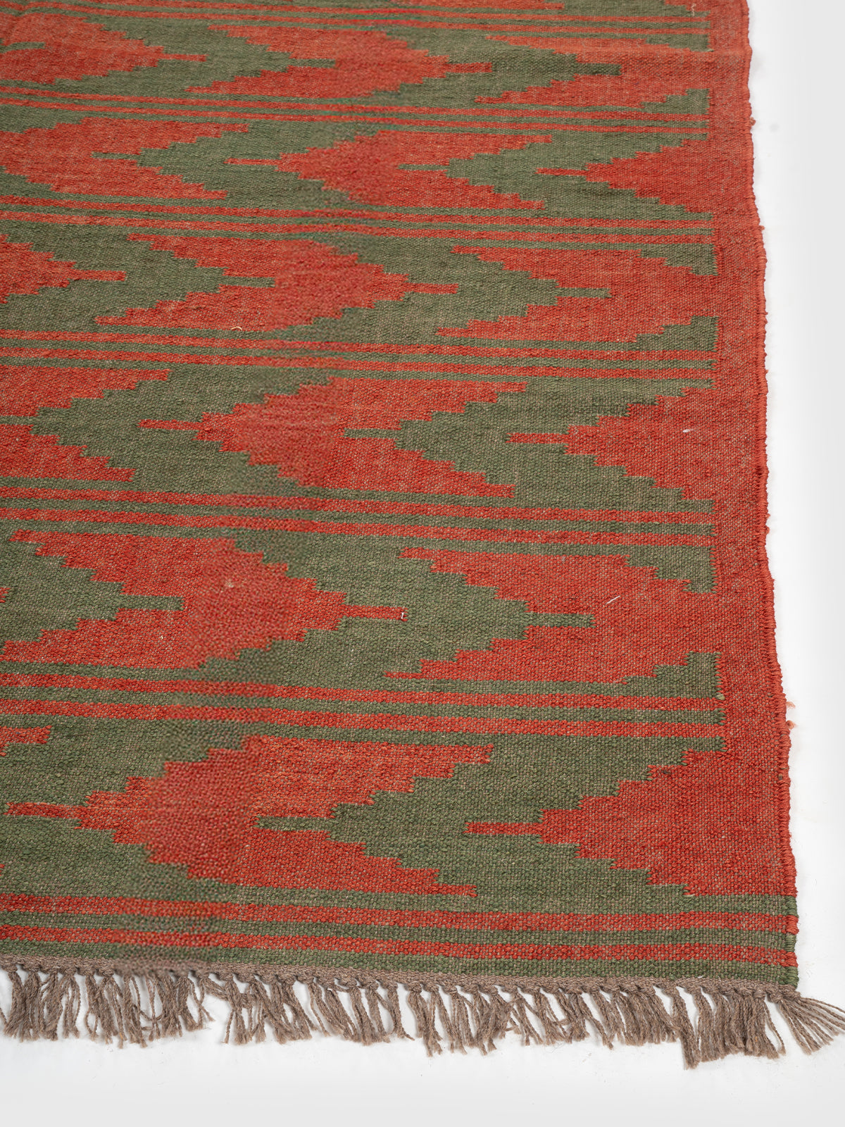 The Grove Wave Rug wool rug styled in a living room interior