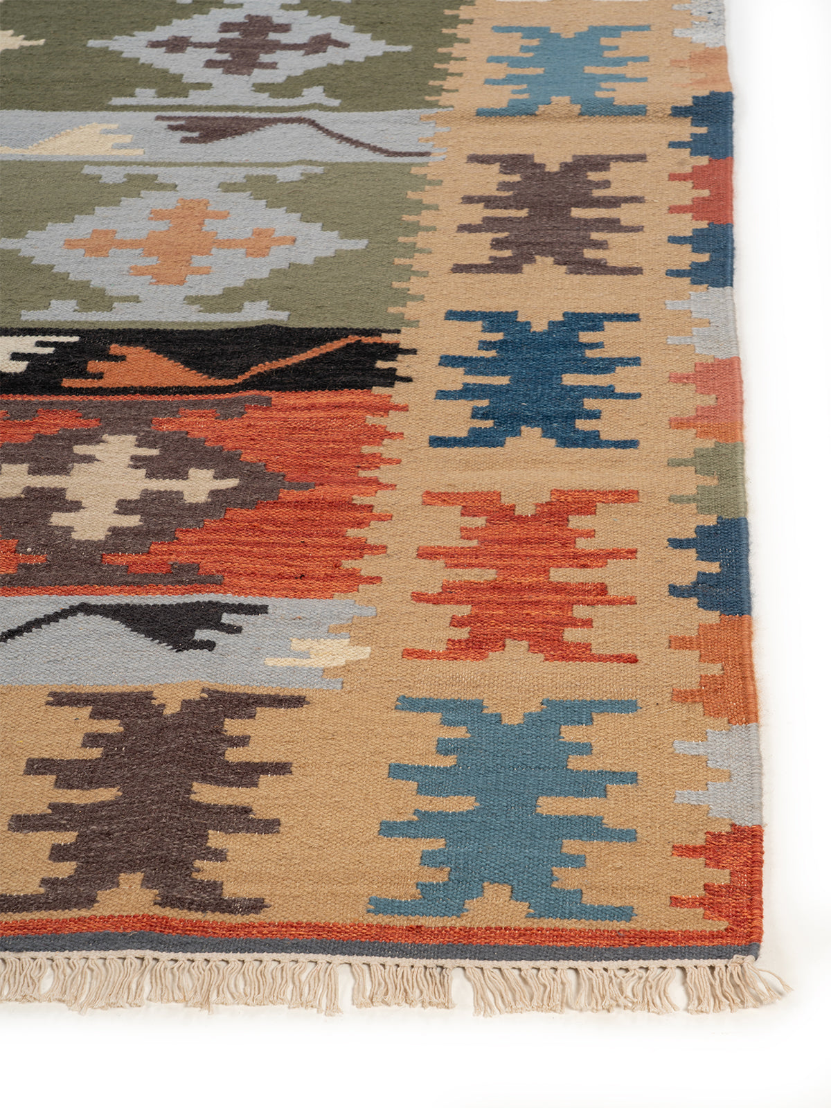 The Harvest Patchwork Rug wool rug styled in a living room interior