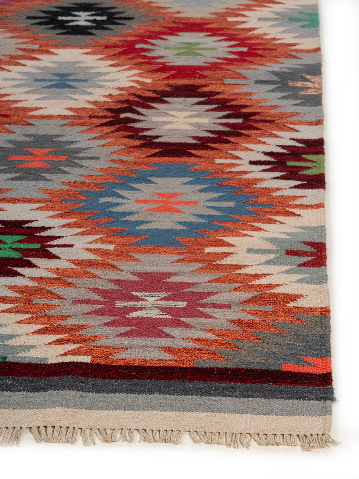 The Kaleidoscope Rug wool rug styled in a living room interior