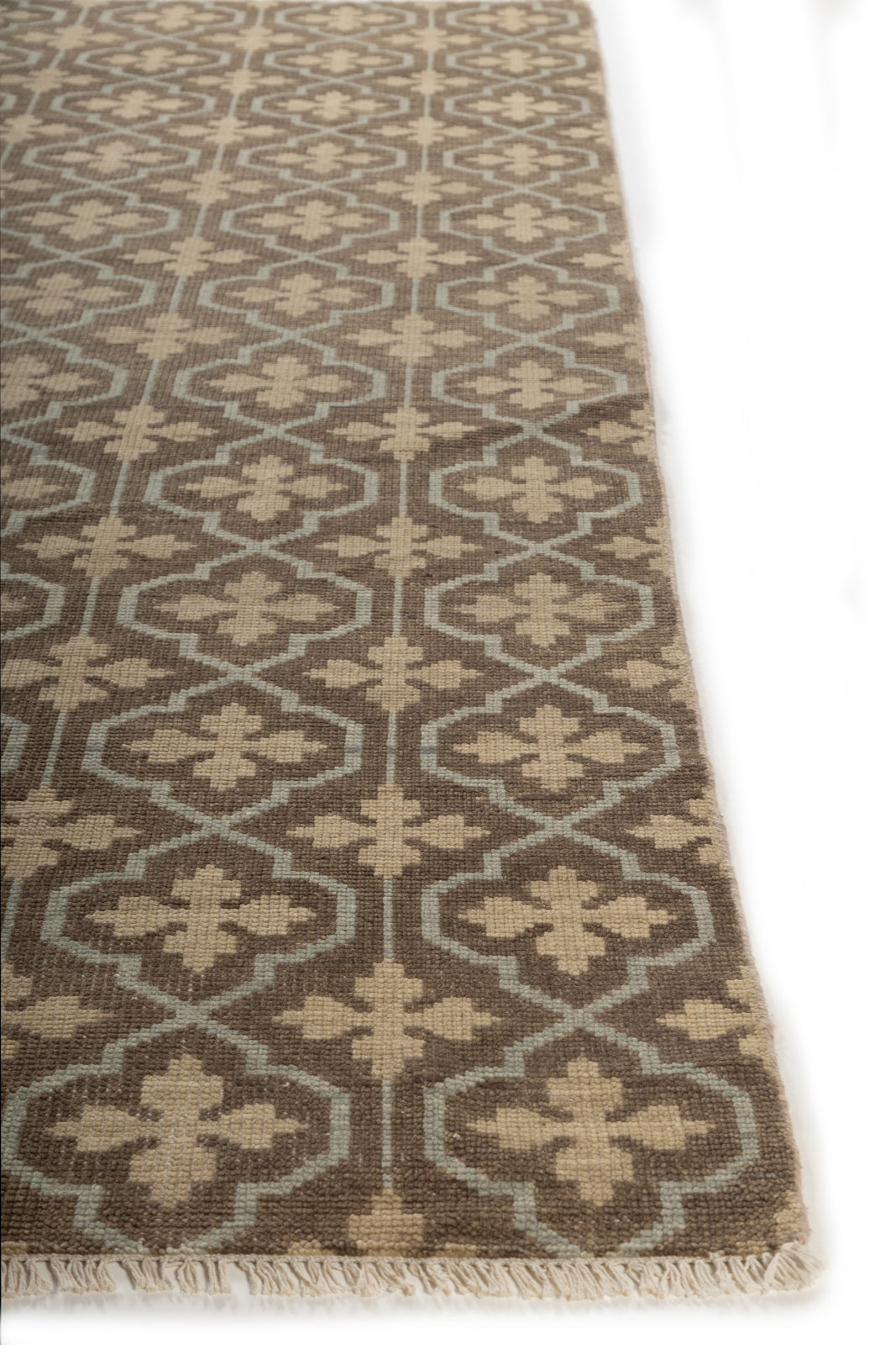 The Kensington Trellis handspun wool rug styled in a living room interior