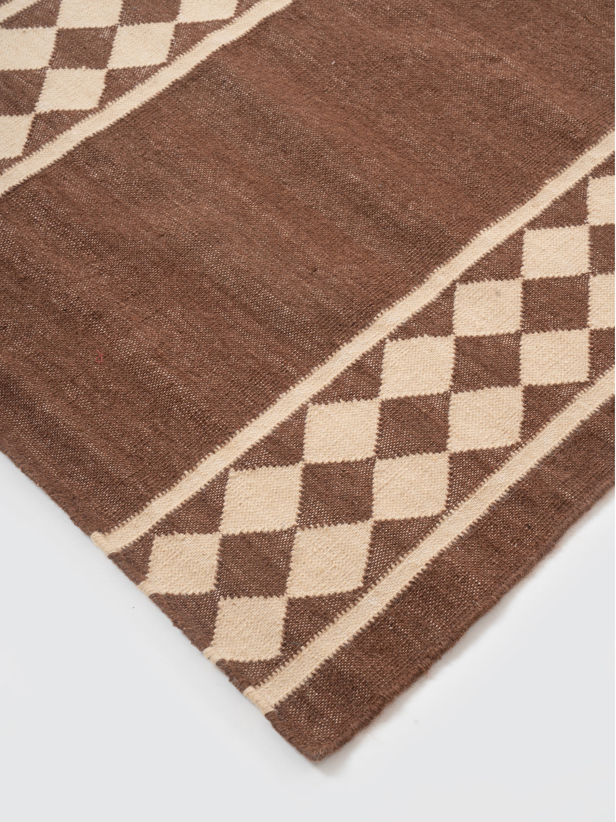 The Lattice Lane Runner close-up showing the cotton weave and geometric surface