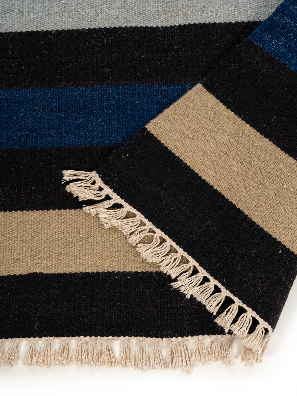 The Midnight Stripes Rug detail of the striped wool surface and edge finishing