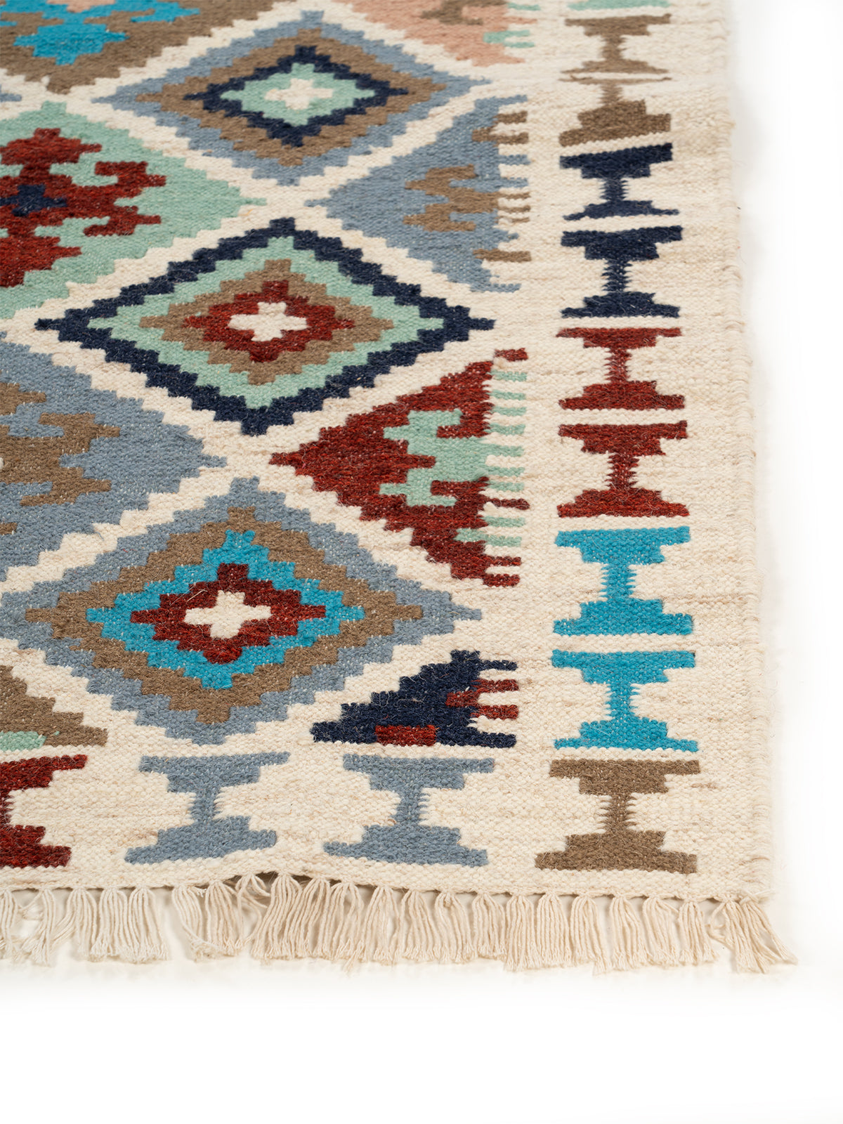 The Moroccan Tiles Rug wool rug styled in a living room interior