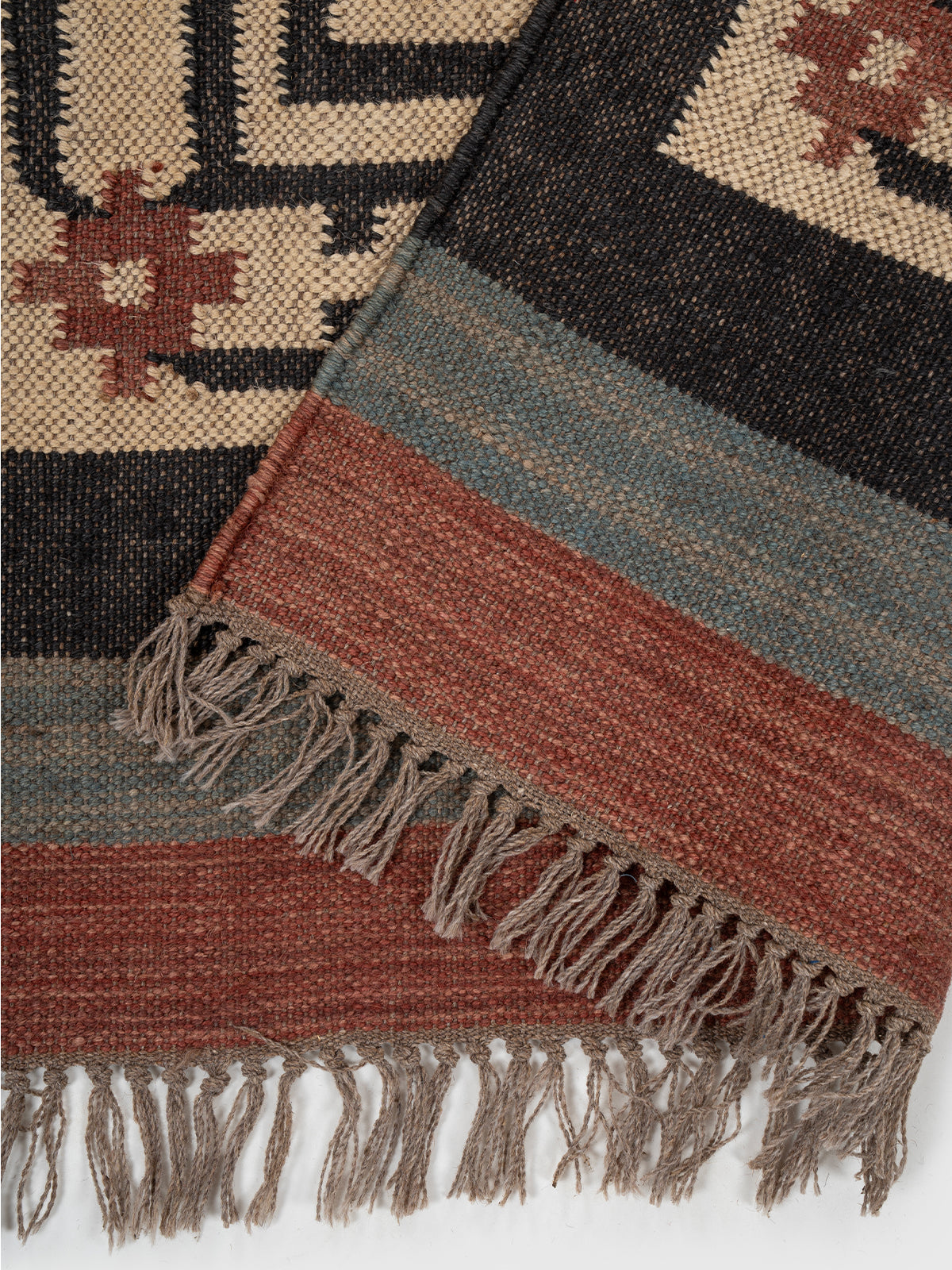The Mythic Panels Runner detail showing edge binding and wool finishing of the runner