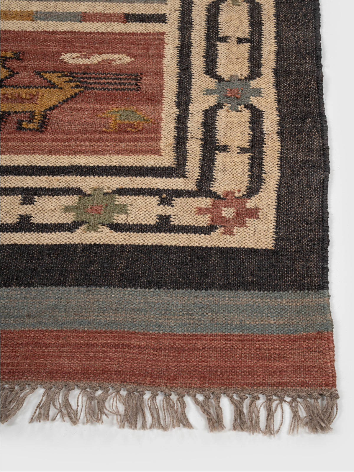 The Mythic Panels Runner wool stair runner styled on a staircase in a designed interior