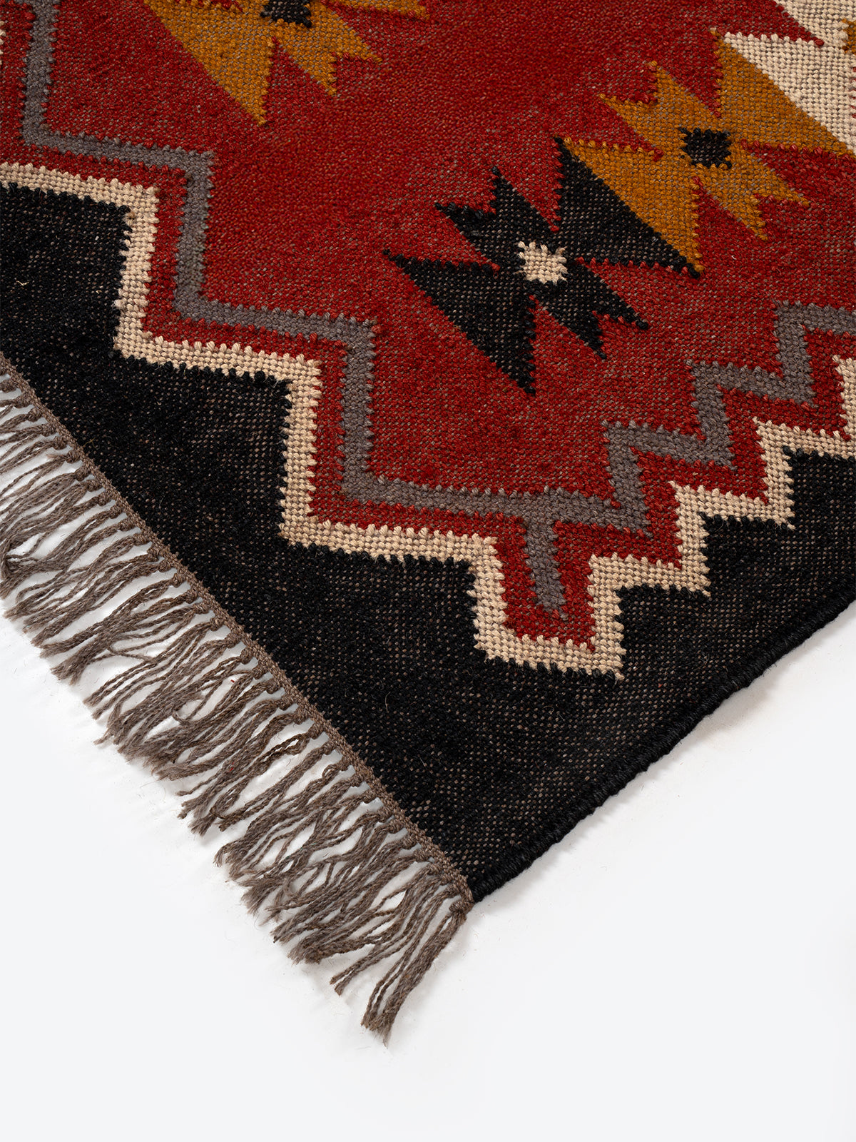 The Nomadic Star Kilim close-up showing the wool weave and geometric motif