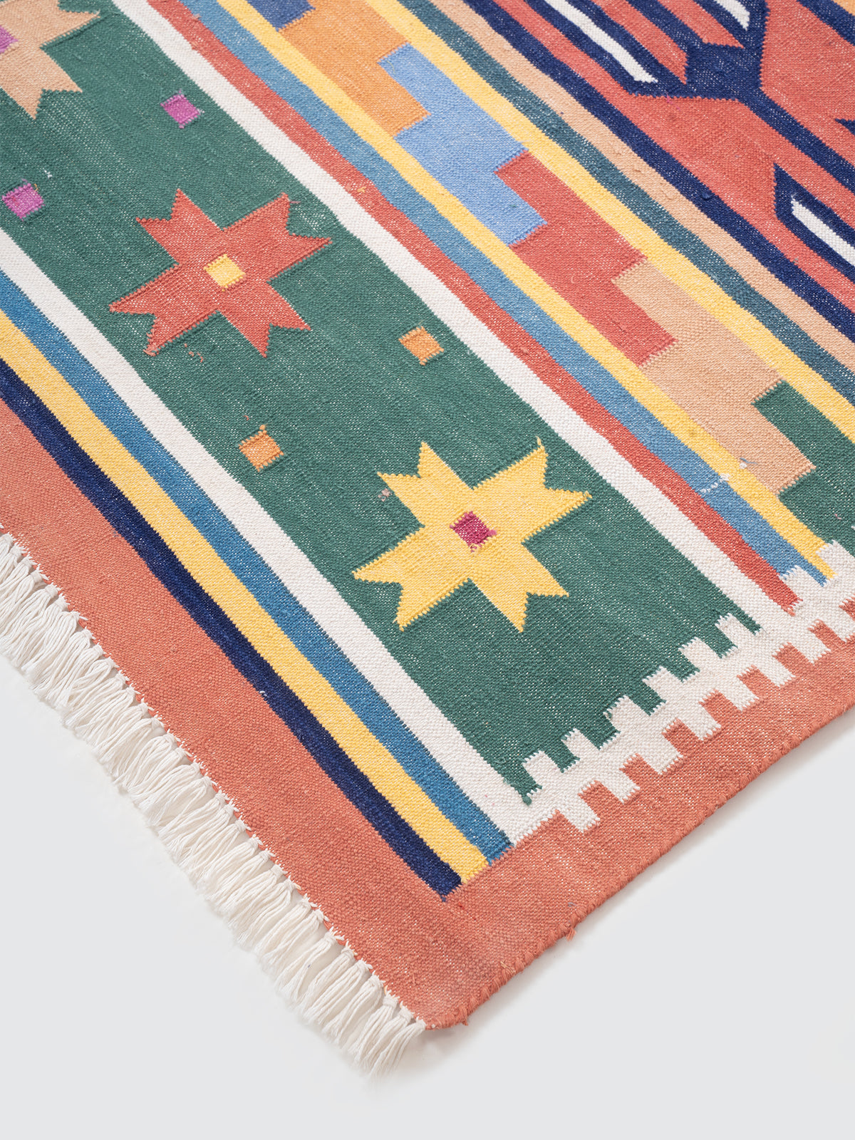 The Nomad's Weave Runner close-up showing the cotton weave and traditional surface