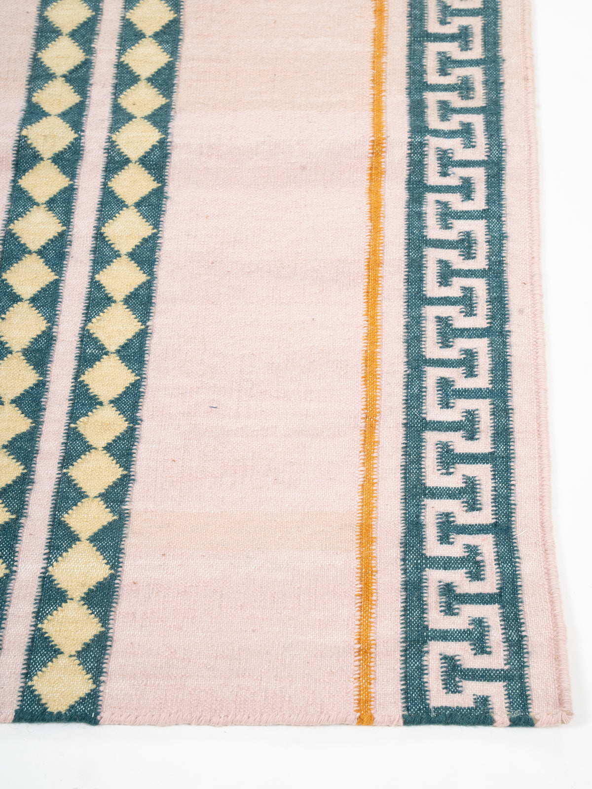 The Palace Key Runner-Pink - cotton runner laid in a hallway view