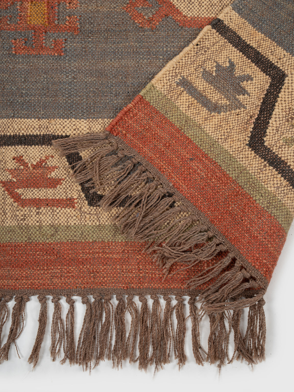 The Patterned Shield Runner detail showing edge binding and wool finishing of the runner