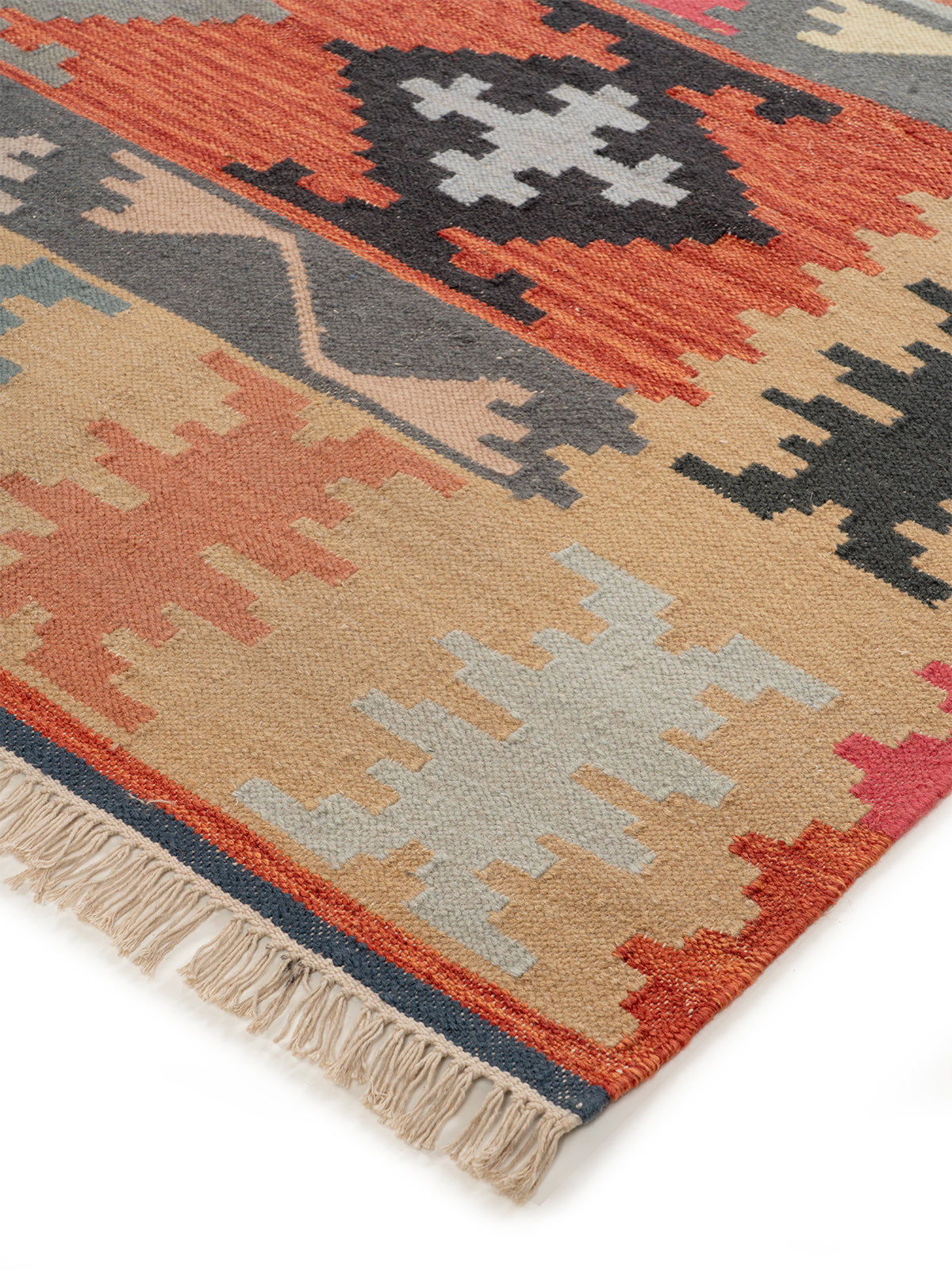 The Rustic Patchwork Rug close-up showing the wool weave and geometric motif