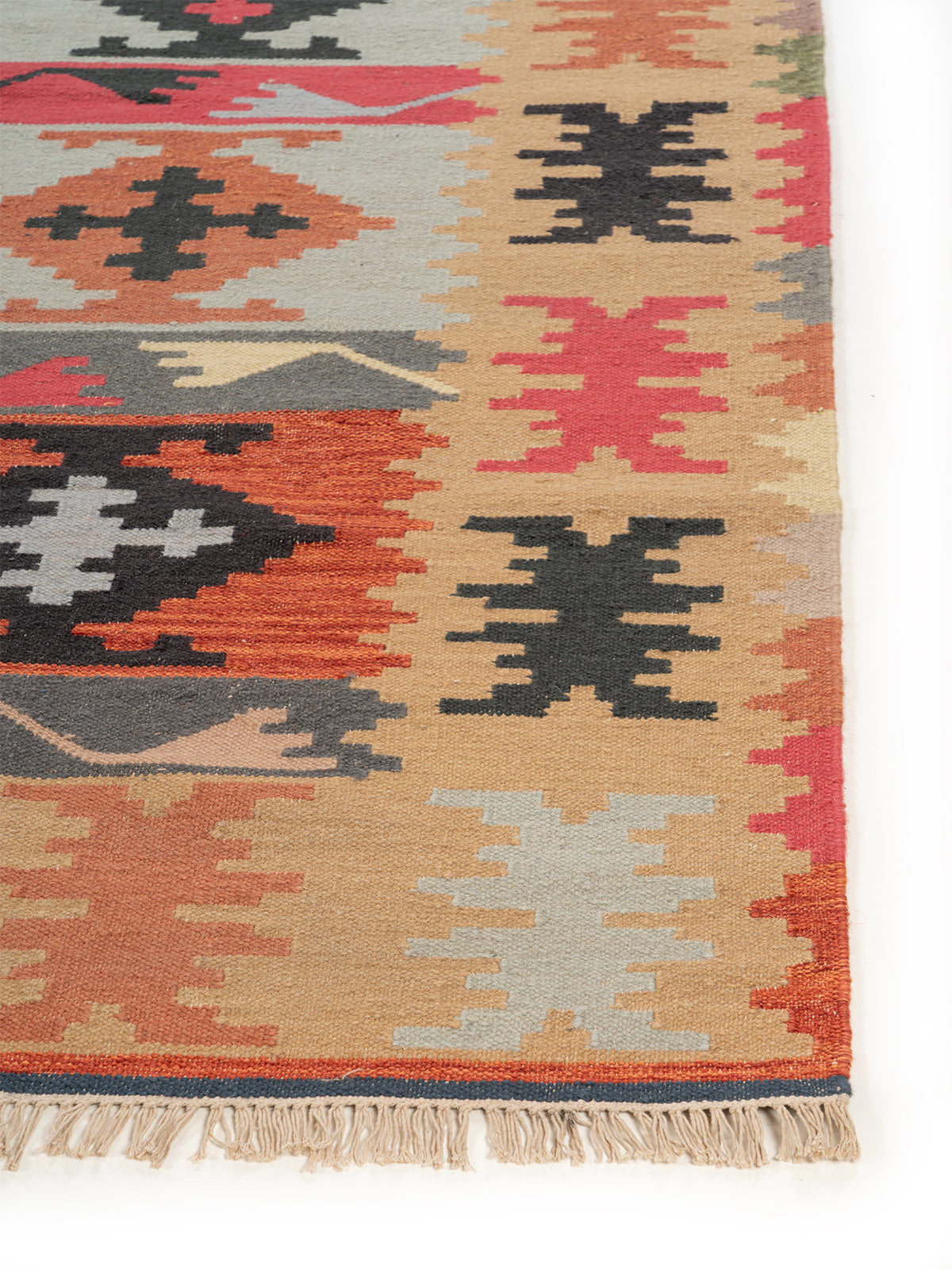 The Rustic Patchwork Rug wool rug styled in a living room interior