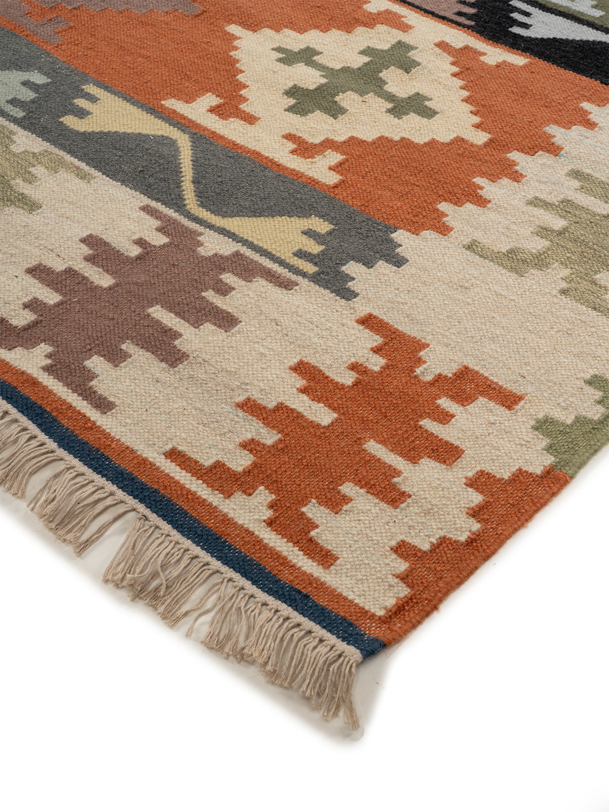 The Rustic Village Rug close-up showing the wool weave and traditional motif