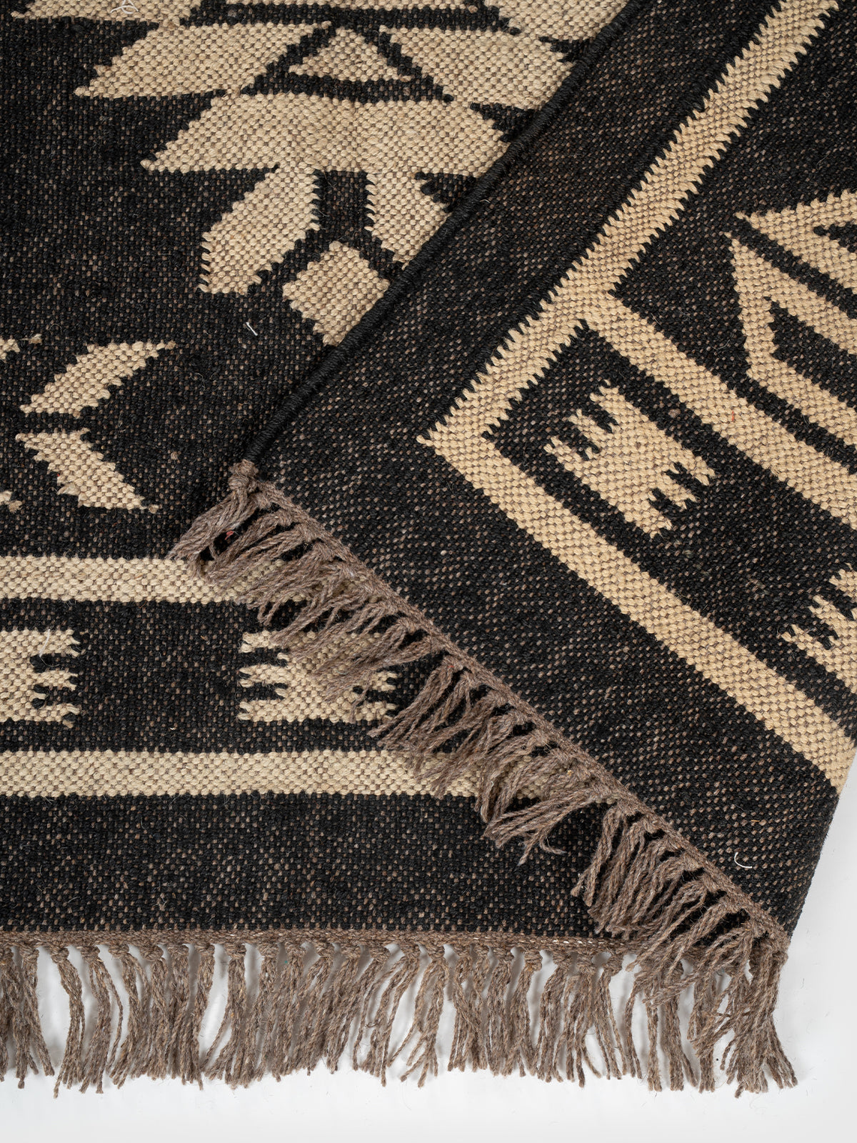The Sky Strata Rug detail of the striped wool surface and edge finishing
